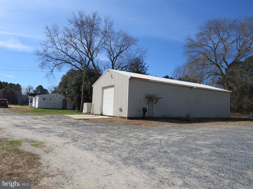2.75 acres, zoned I-1 on the corner of Somerset Avenue and UMES Blvd, just a block from U.S. Rt. 13.  Property is improved by a 912 sq. ft. office/guard building with a full bath and kitchen, needs upgrading.  Also an 1800 sq. ft. metal building with a 12' overhead door, mostly concreted floor, loft area for storage, metal roof and 13 ft. ceilings. Public water and sewer.  Great location for a number of business ventures.   There is a 58.66 ft.  frontage on Somerset Avenue, great spot for signage and a large entrance on UMES Blvd. (Hickory Lane) Property is As IS.