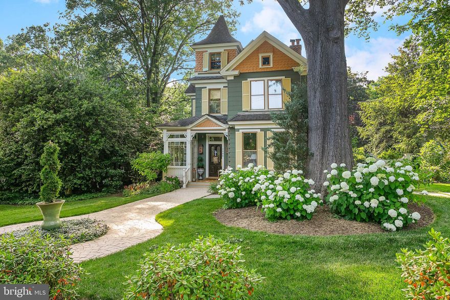 Located on a storybook street in the sought after neighborhood of Westover, step back in time with this stunning Victorian farmhouse that just underwent a $500K+  renovation! Seamlessly blending historic charm with high-end modern design, this home is a rare piece of Arlington history! A newly expanded entry leads to the elegant dining room and chef’s kitchen with custom inset cabinetry, an Ilve Italian range, Sub-Zero appliances (including a wine fridge), oversized island, and French doors to the back deck. The living room and library offer new gas fireplaces, built-ins, and even a hidden “secret” storage room. A custom mudroom and marble-floor powder room complete the main level. Upstairs, a brand-new primary suite features custom built-ins, exposed beams, and a luxurious marble bath with heated floors and clawfoot tub. A recently added full bathroom plus two more bedrooms showcase designer details like grasscloth wallpaper and picture molding, while the recently finished attic serves as a spacious fourth bedroom and office/playroom. Original heart pine floors have been fully restored throughout, adding warmth and authenticity to every room. Outside, enjoy a new screened porch, expansive deck, 16'x16' flagstone patio, and a professionally landscaped yard with smart irrigation, a cobblestone-style driveway, uplighting, and gas lanterns for timeless curb appeal. Just steps to the vibrant Westover Village and 0.5 miles to the East Falls Church Metro, this home also conveys a Dominion Hills Pool membership—bypassing the current 7-year waitlist. With no detail overlooked, this is a truly rare, turnkey offering in one of Arlington’s most beloved neighborhoods.