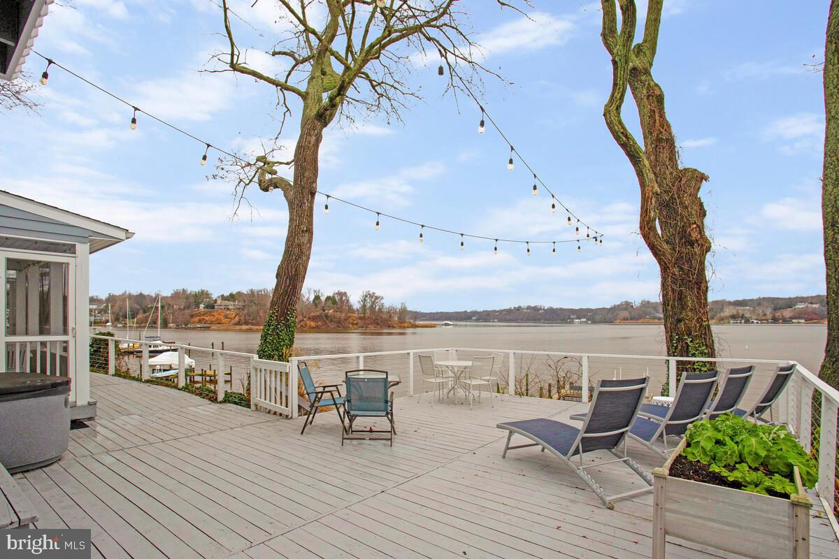 Magnificent views of the Severn River from this stunning home in sought-after Epping Forest Community. Enjoy sunrises and sunsets from every room in this open floor plan. Home features include a gourmet kitchen, first floor en suite, two huge bedrooms with vaulted ceilings and outdoor balconies on the upper level along with 2 full baths upstairs, a wood burning fireplace, a mudroom with 4 built-in lockers, and a screened porch, Outdoors, you will find ample off street parking, an extra large waterfront deck with a hot tub, and a lovely side yard which is fully fenced, a private 120 ft deep water pier with 2 electric boat lifts and 2 jet ski lifts, and a swimming platform, and a kayak storage rack. Excellent fishing and crabbing right off the pier. Epping Forest, a gated community, is an amenity rich neighborhood with a sandy beach, lifeguards, diving board, clubhouse with grill and bar, and many family activities and events. Epping Forest Community is a Special Tax District.