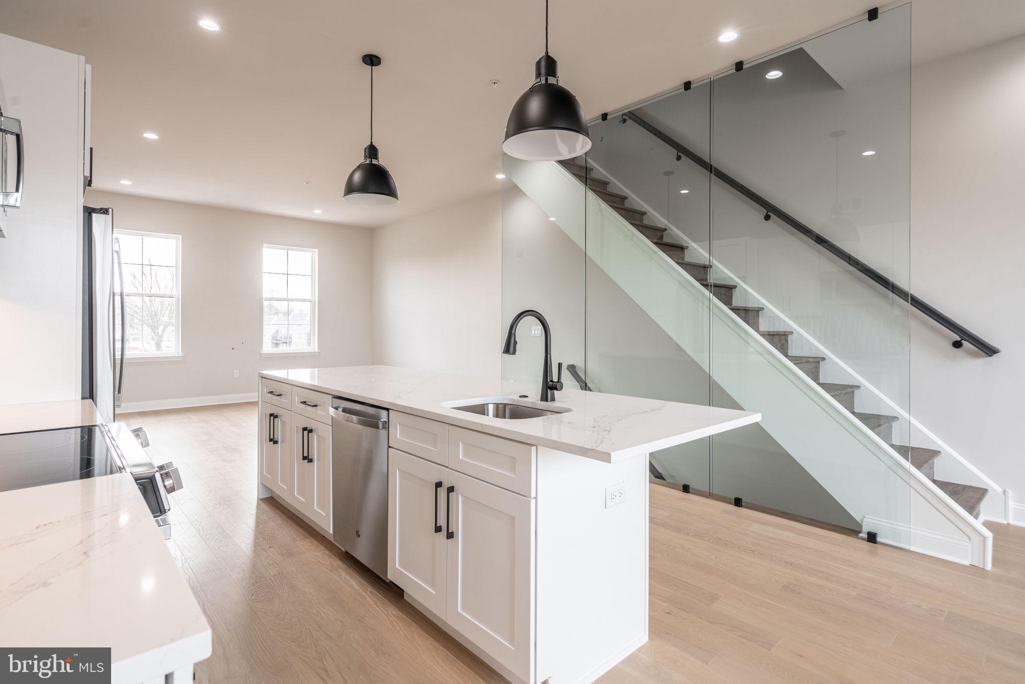 1ST TIME HOMEBUYER LOAN PROGRAM OFFERING $6,000 LENDER CREDIT AND 1% OFF OF YOUR INTEREST RATE.
Welcome to the epitome of urban living with a blend of modern luxury and financial savvy - 4036 Marilyn Drive at Wynnefield Heights Square, a beacon of style and comfort in the heart of Philadelphia. Set to charm you in October 2025, this stunning townhouse offers an unparalleled living experience. Awaiting approval, benefit from a 10-year tax abatement that promises affordability ensuring an attractive investment in your future.
Spanning three generously appointed floors, this home boasts three exquisite bedrooms and three full bathrooms, catering to your need for space and privacy. The first floor introduces a seamless blend of utility and style, featuring a convenient bedroom and bathroom suite alongside a mechanical closet, further leading to a 1-car garage adorned with recessed lighting, a remote-operated overhead door, and a durable concrete floor - a rare find in city living.
Ascend to the second floor where your culinary dreams come alive in a kitchen designed to impress. Manufactured quartz countertops complement an expansive island, setting the stage for memorable gatherings. GE stainless steel appliances, under-cabinet lighting, and 42" high wall cabinets elevate your cooking experience, while the engineered white oak flooring adds warmth and sophistication throughout. This level also hosts separate living and dining areas, with a patio off the dining room inviting natural light and offering a glimpse of the neighborhood's vibrance.
The third floor is a sanctuary of comfort, housing the master bedroom complete with essential amenities like a comprehensive closet system and a master bathroom ·featuring a double vanity, frameless glass enclosure, and tiled finishes that evoke serenity. The additional bedroom mirrors this thoughtful design, ensuring comfort for all residents.
Topping off this residence is a roof deck, a private retreat overlooking the cityscape, promising serene mornings and lively evenings under the Philadelphia sky. With every detail thoughtfully curated to enhance your lifestyle, 4036 Marilyn Drive isn't just a home; it's the cornerstone of your new chapter in Wynnefield Heights Square.