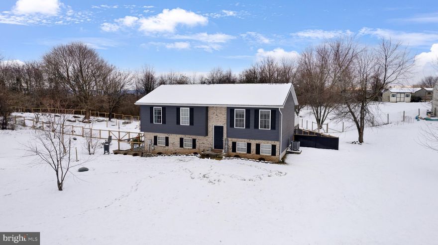 Discover Your Dream Home on a Sprawling One-Acre Premium Lot! Nestled in a tranquil corner of a friendly neighborhood, this attractive 4-bedroom, 3-bathroom home offers the perfect blend of luxury and comfort. The living space was fully renovated in 2018, it radiates modern elegance with stainless steel appliances, stunning granite countertops in the kitchen and bathrooms, and an effortlessly chic combination of premium ceramic tile and groutable vinyl flooring. The lower level of this splendid home is ideal for guests staying over, offering both privacy and comfort. Step outside to relish in the beautifully fenced backyard, a safe haven for your beloved pets. Additionally, the property features a spacious 2-car garage and an expansive 20x15 back deck, perfect for outdoor entertaining and relaxation. All of this with easy access to town. Don't miss the opportunity to make this serene oasis your own!