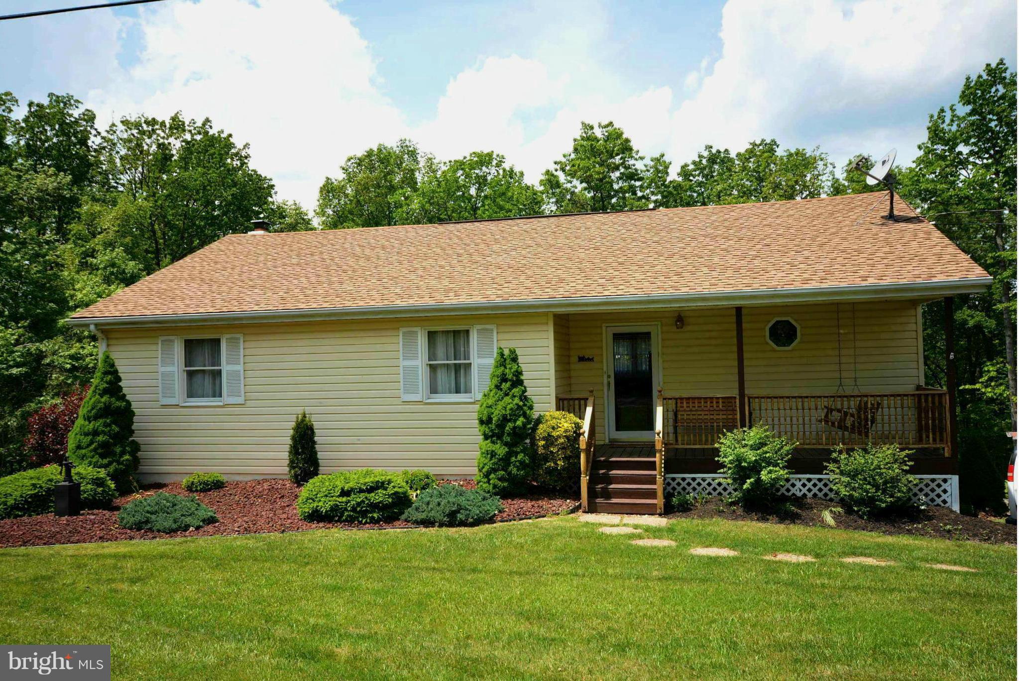 **WELL MAINTAINED HOME INSIDE AND OUT ** Home offers 2+acres, Off State Maintained Road, Approx. 1 mile from VA line, Screened Porch, Large Deck, Hot Tub, Kitchen was remodeled in 2009 with American Woodmark Cherry Cabinets, Dishwasher and Stove 1 Year Old, New Refrigerator was bought this year, Woodstove, New HVAC done in October 2014 and 50 Year Architectural Shingles done in 2009. A Must See!