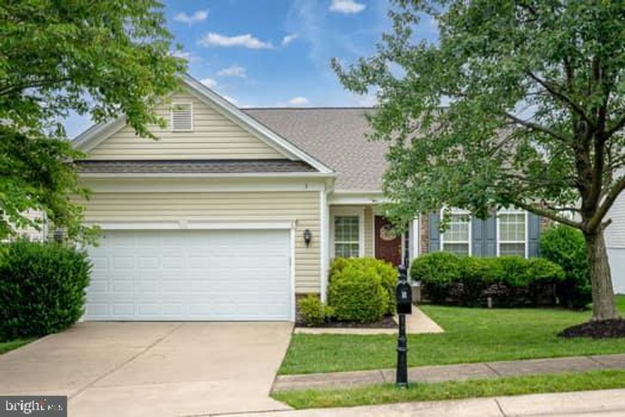 You are not going to want to miss out on this Gorgeous; well maintained "Rapidan" model situated on a premium homesite within the highly coveted Falls Run Community by Del Webb.   You will not want to wait to step inside this comfortable home that shows like new and is totally functional for main level living but with the added bonus of a finished walkout basement.   On your main level you start with a wonderful eat in kitchen with hardwood floors, easy care solid surface Corian countertops, beautiful wood cabinetry, stainless steel appliances, pantry and of course what kitchen would be complete without a work island?     Not only does this spacious home include a magnificent " En-suite" with a large walk-in closet in the bedroom but it also has separate vanities and a soaking tub as well as a walk-in shower in the bath.   Your very own retreat!  In addition to a second main level bedroom this wonderful home has a den/study with glass French doors as well.  The open Great Room/Formal Dining Area has such a stunning marble fireplace you will want to have all the holiday parties at your home just so everyone you love can enjoy as well.   You will not need to wait until the holidays for entertaining though; because right out the atrium door of your Great Room takes you to your awesome large, screened porch with a soaring vaulted ceiling and ceiling a fan.   Don't worry if you love grilling the home has it all including an open deck off of the screened in porch.  It goes without saying the decking material for both the screened in porch and open deck are made of easy to care for composite decking materials.   This home wants you to have it all and have time to enjoy it!  So, as you can tell this home offers total main level living, but you will recall it doesn't stop here with an impressive hardwood staircase taking you to the walk-out basement below.  This basement offers full size windows, so it doesn't have that basement feel...no it has a true living area feeling.  The lower level has a huge Activity (Game, Rec, etc.) room, bedroom, hobby room and full bath, please don't worry even with all of this living space you have vast unfinished storage area that we know you will put to good use.  Out your sliding glass doors will take you to an extensive concrete patio for additional outdoor living.  Schedule your appointment today because you're not going to want to miss out on this magnificent home.