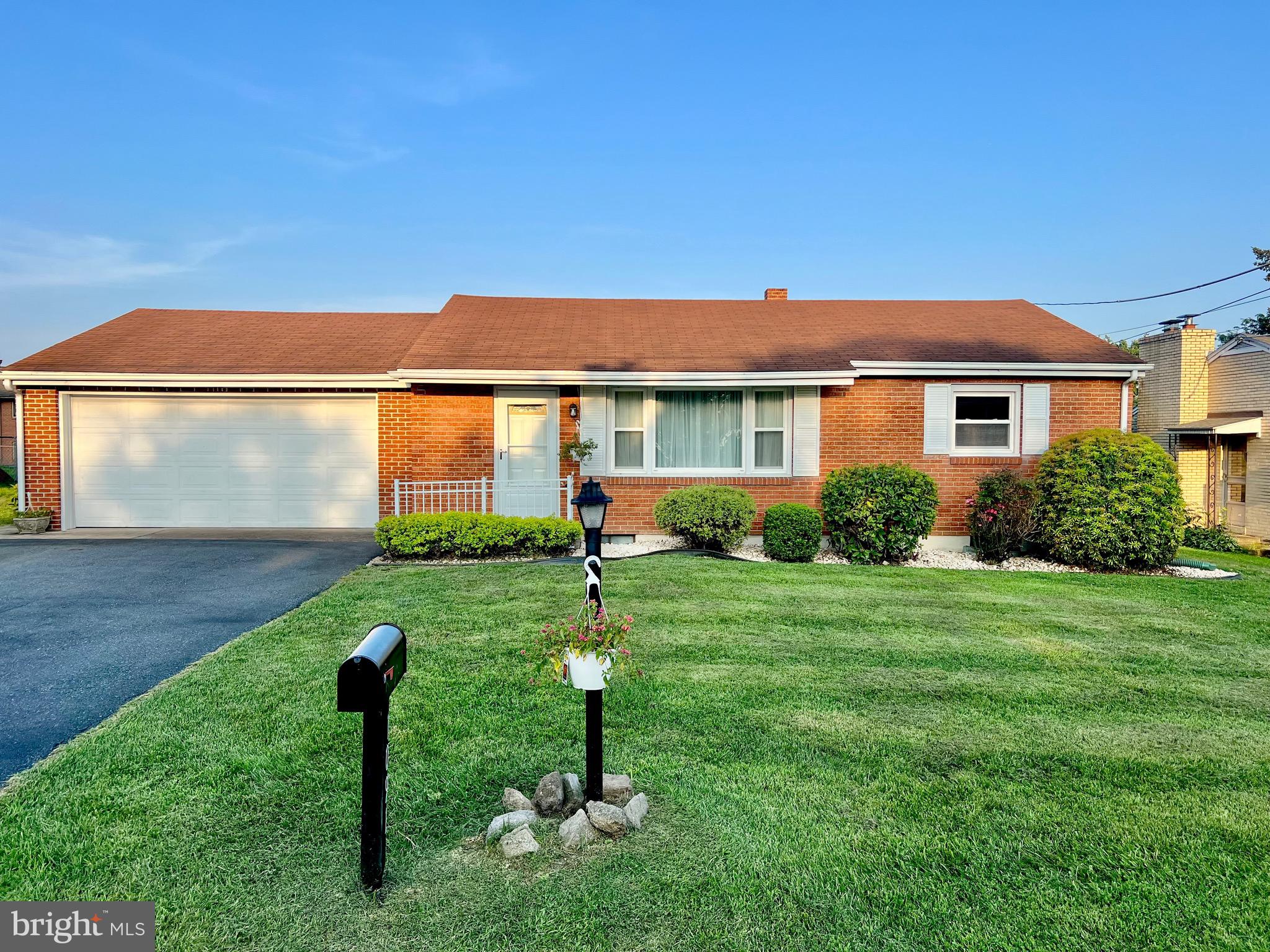 This charming ranch-style home, nestled in the heart of Dauphin County, offers a perfect blend of comfort and functionality. Set on a semi-private road, you immediately feel at peace and admire the quiet atmosphere. Built in 1963, this well-maintained residence features a solid, warm brick exterior and a welcoming layout that invites you in. Step inside to discover a spacious living area adorned with beautiful original hardwood floors and an abundance of natural light. The kitchen boasts upgraded corian countertops, recessed lighting and modern appliances, ensuring that meal prep is a delight. With two generously sized bedrooms and a full bathroom featuring a tub shower, this home provides ample space for relaxation. The partially finished basement offers additional versatility, perfect for a family room, home office, or hobby space. Outside, the 0.17-acre lot features a level yard with thoughtful landscaping, providing a serene retreat for outdoor activities or gardening. The attached oversized two car heated garage and driveway accommodate multiple vehicles, ensuring convenience for you and your guests. This delightful property combines classic charm with modern amenities, making it a wonderful place to call home. Don't miss the opportunity to experience the comfort and warmth this residence has to offer. Professionally painted and cleaned throughout. Recessed lighting and new fixture installed in the kitchen and dining. Services were recently completed on septic, A/C and furnace, all to get ready for you!