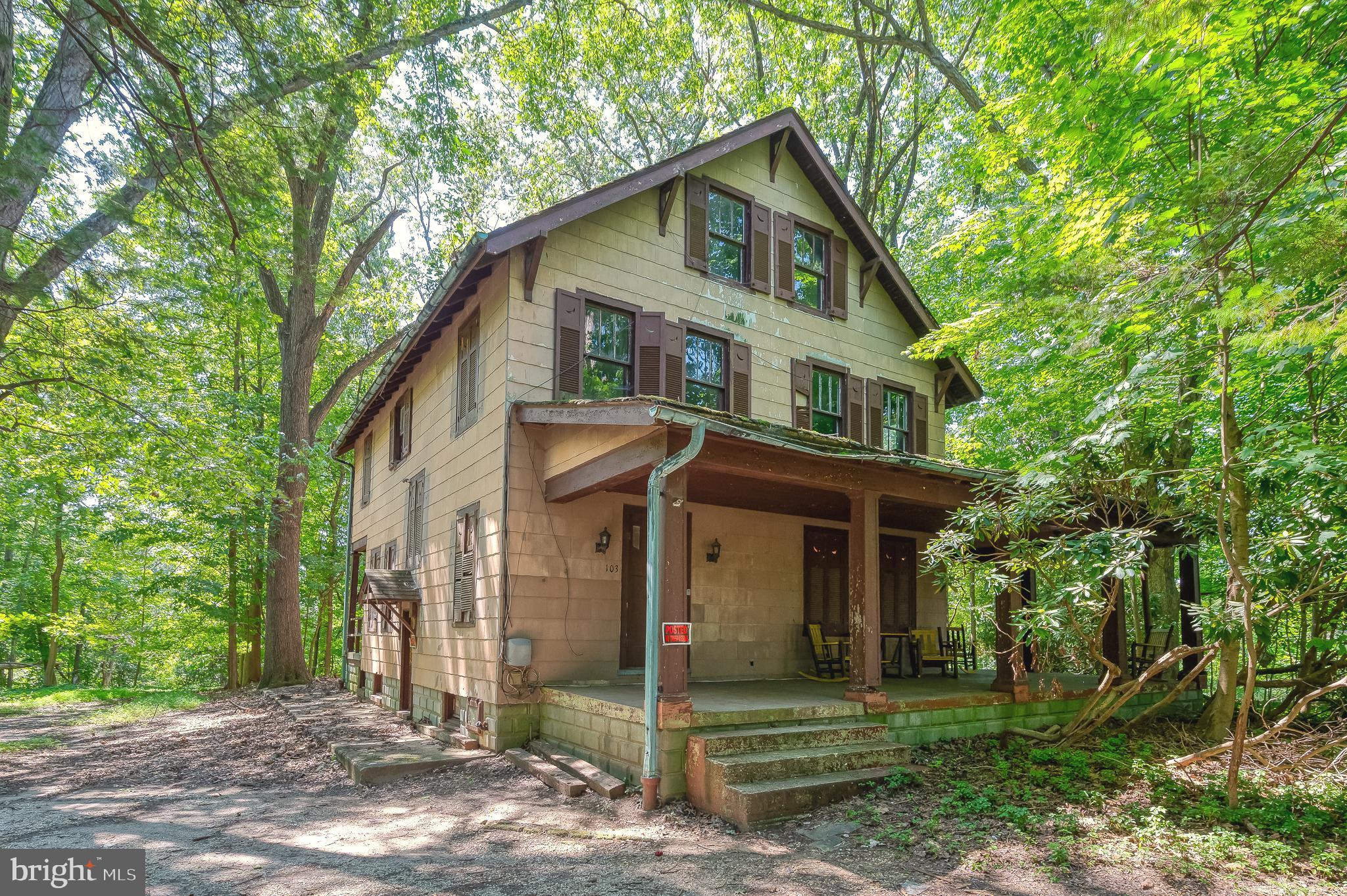 This offering includes three parcels. Almost three acres.... Built in 1926 – A Unique Opportunity Awaits! Don’t miss this rare chance to own a one-of-a-kind property nestled in nature yet close to everything. This offering includes three parcels: the main parcel is 1.7 acres, with two additional parcels measuring 0.60 acres and 0.68 acres, providing ample space and potential. Tucked back in the woods, this solidly built home is ready for your personal touch. Inside, you'll find original wood floors and spacious rooms that highlight the character of this historic residence. The first floor features a large foyer, living room, formal dining room, and a lovely sun porch—perfect for enjoying morning coffee or a good book. Upstairs, there are five bedrooms, including one that serves as a pass-through to the full third floor, offering even more living or storage space. A full basement adds to the functionality of the home. Step outside to relax on the inviting front and side porches, and take in the peaceful surroundings and natural beauty that envelop this property.