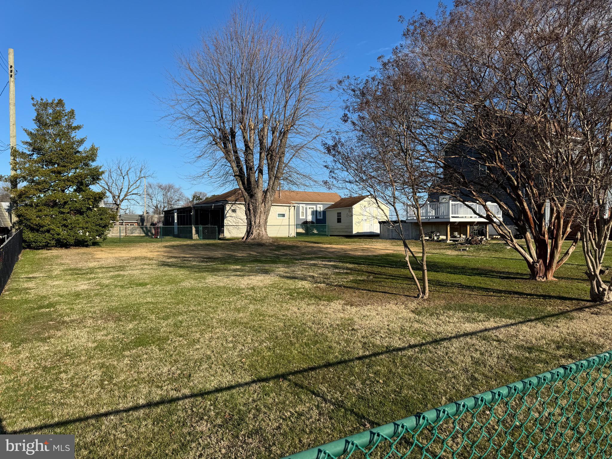 Welcome to 9104 Avenue C, a unique opportunity located on the picturesque Peninsula of Sparrows Point, Maryland that is rich in history! This property consist of only one tax record. Part of the lot on the street side is all grass and on the back alley side there is access to a single-family detached 1-bedroom, 1-bathroom dwelling that features a screened porch and a fenced yard. A fence divides the larger land from the dwelling and the property offers a magnificent view of the Historic Todd Family Farmhouse and pastures. To and from the property the drive offers views of Shallow Creek thru to the Chesapeake Bay. The 9,750 sq. ft. lot offers significant potential. The potential is subject to the Baltimore County and the State of MD agencies permitting as well compliance with Chesapeake Bay Critical Area guidelines and approvals. The vacant land area may provide the opportunity to construct a new dwelling in the future if all agencies give the approval. The Buyer is responsible for all cost associated with any future development plans. The seller is motivated and does not want a lengthy contingent offer. The current dwelling was previously occupied by a long-term resident and now vacant. This property has potential rental income with potential future new home development possibilities. The entire property is being sold as is. The Buyer is to verify at the Buyers expense any and all permitting, zoning as well as any future development. Please do not enter or walk upon the property without an approved agent accompanied appointment. Buyer again to verify all zoning, permitting and additional building at buyers expense.