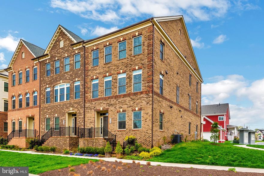 Stunning 3-Level All Brick 24' wide End unit Townhome in Villages of Urbana! Spacious & Gorgeous! Entry Level office/recreation room/ play room plus Full Bath, over sized 2 car garage in the back. Wide open main level features gleaming wood floors, spacious living room, centrally located designer kitchen, Elegant family room with a modern gas fireplace, and a large deck. Master bedroom w/tray ceiling, walk-in closets, floor-to-ceiling tiled Master bath. Very nicely upgraded carpet, generous sized bedrooms,  with pond view and walking distance to shopping, restaurants and library! Available for  August 1st move in