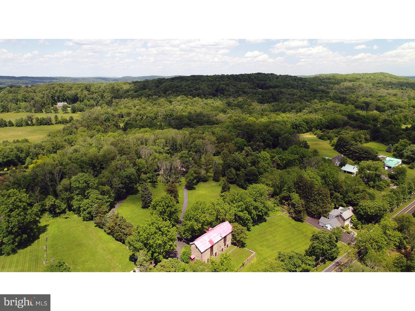 Proudly Offering now, the lone barn in Upper Makefield Township, Pa that was built in two sections, in early 1800's. This Stone Bank barn, is situated on 25.7 acres , along with a 3900+ sq ft custom built Farmhouse reproduction . With your own vision, "Penny Pot" Farm may make your dreams come true! Low Taxes(8,046. yearly). The handsomely built Historic Wiggins Double Bank Barn depicts their dates, respectively, in 1807 and 1833. The barn has three floors and includes full stable facilities and workshop. Also on the property is a Stone and Cedar sided reproduction Farmhouse, providing 4, possibly 5 bedrooms, 3 1/2 baths, three fireplaces, and ample closet space. Four zoned heating and cooling. Hardwood flooring in most rooms. Offered too, is a versatile floor plan with gourmet kitchen, banquet sized dining room, and stunning library with floor to ceiling cherry bookshelves, plenty of windows, and amazing views. Exposed beams in the great room with stone fireplace and bay window. Large mud room/laundry room with 2 closets, powder room and lots of cabinet space, are also found on the first floor. Partially finished basement (walk-out), with full bath and in-law suite possibilities, and a gym. Nice 20' x 20' foot gazebo. Please note, the following improvements, or additions have been made by the Owner: Total new, bump out kitchen with cherry cabinets and granite counter tops and skylight; partially finished basement creating a second den with a full bathroom; enclosing former porch and creating a banquet sized dining room; remodeled all full bathrooms and finished the two car garage with insulation and sheet rock. The property is in Act 319, Forestry Program. Home Warranty included . Make an appointment today,to see "Penny Pot" and spend some time on this vast property. It is like being in your own park! ( The Offer for The advertised accommodation, for a Luxurious Beach Front Condo for 2, for one week for 5 years , May thru October, in Anguilla, ends, July 31, 2017) Property also for lease . See 6986565 !