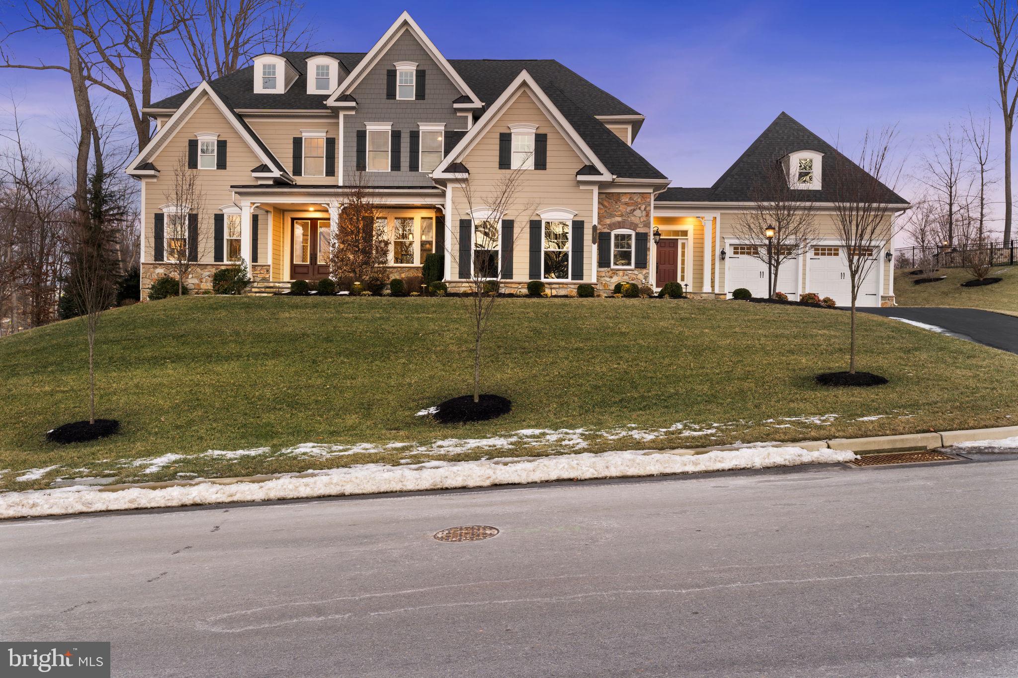 Welcome to 1 Gershwin Drive, a stunning residence in the heart of West Chester and the desirable Greystone community, offering an exquisite blend of elegance and modern comfort. Built in 2020 and never lived in, having operated as a model home, this is a fantastic opportunity to purchase a new construction property without the time spent during the process. Boasting over 8,000 sqft, this gorgeous property has everything one could dream of.
Step inside to discover a grand foyer that sets the tone for the luxurious features throughout. Adorned columns lead you into the formal living room which lies across from the formal dining room. The dining room is equipped with a tray ceiling, luxury crown molding and wainscotting. Moving beyond the dining room leads you to a butler's pantry and into the gourmet chef's kitchen, truly a sight to behold. Featuring quartz countertops, two huge dual-coloured islands, luxury custom cabinetry, a walk-in pantry, a 5-burner gas cooktop, double wall ovens, two dishwashers, wine coolers, tile backsplash, and so much more, the kitchen is an absolute chef's dream. The kitchen leads into the bright and spacious breakfast area, and is open to the stunning two-story family room. Featuring a built-in media center and cabinetry surrounding the gas fireplace, huge windows, and ample amounts of natural light, this is the perfect place to enjoy family gatherings together. A spacious and bright office lies on the opposite side of the family room, along with a powder room for convenience. A mudroom with ample amounts of storage and access to the 4-car garage completes the experience of the first floor.
The second floor of the home boasts four spacious bedrooms, each offering a private retreat with its own en-suite private bathroom. The Master Bedroom is complete with a private sitting area, a private balcony, a gigantic walk-in closet that spans the entire length of the wall, a Master Bathroom with a floor-to-tile custom shower, soaking tub, and double vanities. The other private bathrooms are also quite impressive and no expense was spared into ensuring a consistent feel throughout the home. The walk-in laundry room is also found on the second floor for that extra bit of convenience.
The nearly fully finished walk-up basement is a sight unto itself. As you step down into the basement, you are greeted by high ceilings, tons of natural and recessed lighting, a second family room with a natural stone accent wall, a wet bar fully-equipped with granite countertops, a dishwasher, wine cooler, and tons of room for storage. Another flex entertainment space lies in front of the wet bar area with another natural stone accent wall. A private home theater lies beyond double-doors near the bottom of the staircase. Tucked back behind the staircase is a private bedroom and a full bathroom, with the bedroom currently being furnished as an exercise room. Tons of storage also lies in the unfinished portion of the basement.
In the rear of the property you will find a flawless maintenance-free deck that leads down to custom hardscaping and a grand stone fireplace, complete with ambient lighting and gorgeous views of the stunning vista that surrounds the property. Ample amounts of yard space also lie behind the home as well.
This exceptional property combines luxurious amenities with a prime location, making it a perfect choice for discerning buyers seeking an unparalleled living experience. Within the Greystone community, one can enjoy the relaxing walking trails that span miles through Robert E Lambert Park. Don't miss the opportunity to make this house your home. Schedule a viewing today!