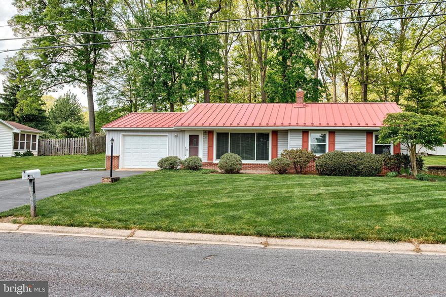 Move in ready, well maintained home just minutes from Penn State, shopping, parks and schools.  Large windows in the main living area, cozy dining space with built in shelving and bay window.  Efficient kitchen convenient to the one car garage for ease of groceries. Lower level bonus area ideal for rec room and home office. Spacious backyard perfect for pets or entertaining.  Wood flooring under carpet.