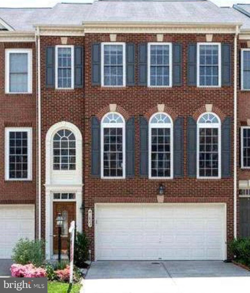 Spacious brick front town home that lives like a single family home! Almost 3,000 square feet of luxury living under $500,000. Pottery Barn style light fixtures, custom moldings & fresh paint throughout give this home a feeling of warmth. Gourmet kitchen with stainless steel appliances including double ovens, island & work station open to the dining room. Generously sized family room with tons of natural light. Hardwood flooring throughout the main level. The master suite provides the perfect retreat with sitting room space, walk-in closet & spa like bathroom with granite countertops. Two additional bedrooms, full bathroom & washer/dryer on the upper level. The lower level recreation room is perfect for entertaining with a bar, half bathroom & garage access. The home also has a trex deck off of the kitchen & fully fenced yard. Welcome Home!
