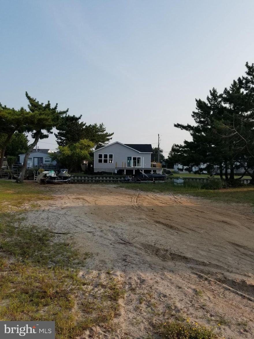 Build your Dream Home in Wonderful Ocean City, Md. On this bayside waterfront canal building lot- close to the BEACH!Sunny Southern Exposure, conveniently located on quiet street with a traffic light and bus stop.The waterfront canal is bulkheaded,with navigable waters allowing easy access to beautiful Assawoman Bay for Boating, Fishing, Crabbing or Jet Skiing.Close to Shopping, Restaurants and Ocean City's Fabulous Boardwalk