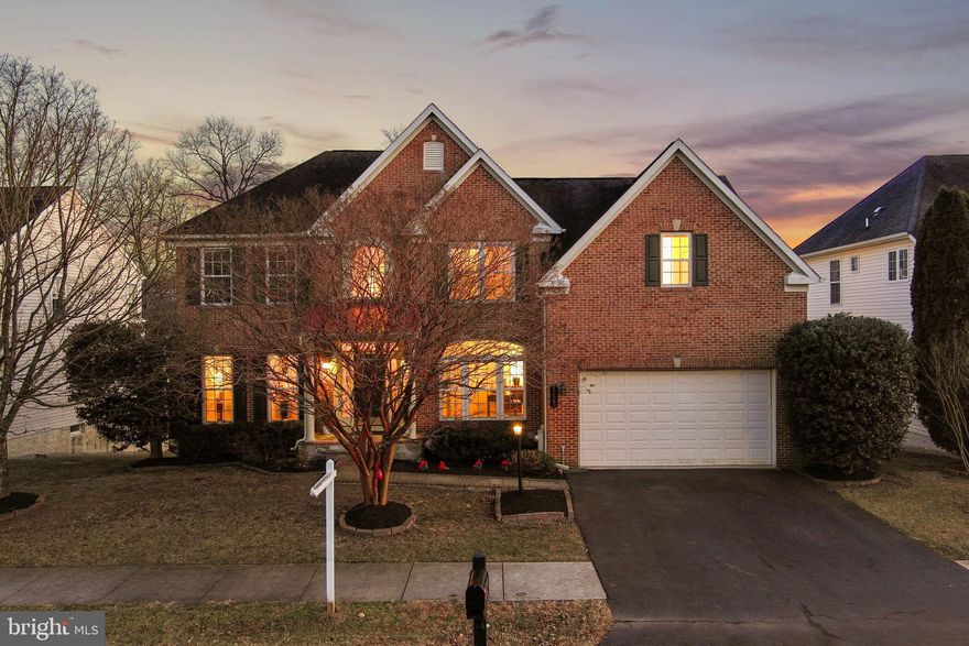 This stunning 4 bedroom+ home offers effortless living with thoughtful details at every turn. Freshly painted throughout with refinished hardwood floors and new carpet, it is spacious and inviting.  

**Main Level: The sunshine coming into this home will win you over when you see the gorgeous natural light blanketing the eat-in kitchen, which overlooks a large deck and southern-facing backyard. The streaming light continues into the adjacent vaulted family room, which has oversized windows, a cozy fireplace, and a second staircase for easy access to the upstairs bedroom level. The main level also includes a private office, formal dining room, formal living room, and a convenient half bath.  

**Upstairs, four bedrooms include a luxurious primary suite with two walk-in closets, a private sitting area perfect for meditation or reading, and a spa-like bathroom with dual vanities, a soaking tub, separate shower, and private toilet room. Three more bedrooms and a full bath round out this level.  

**The walk-out basement is truly special—a complete guest suite with a living area, kitchenette, a full private bathroom, and a bonus room used as a guest bedroom. Perfect for extended family, visitors, or multi-generational living.  

**Step outside to your private oasis: a spacious deck, with a one-year-old automated awning, overlooks parkland, mature trees, and a small pond. The southern exposure bathes the outdoor space in beautiful sunlight all day long.
