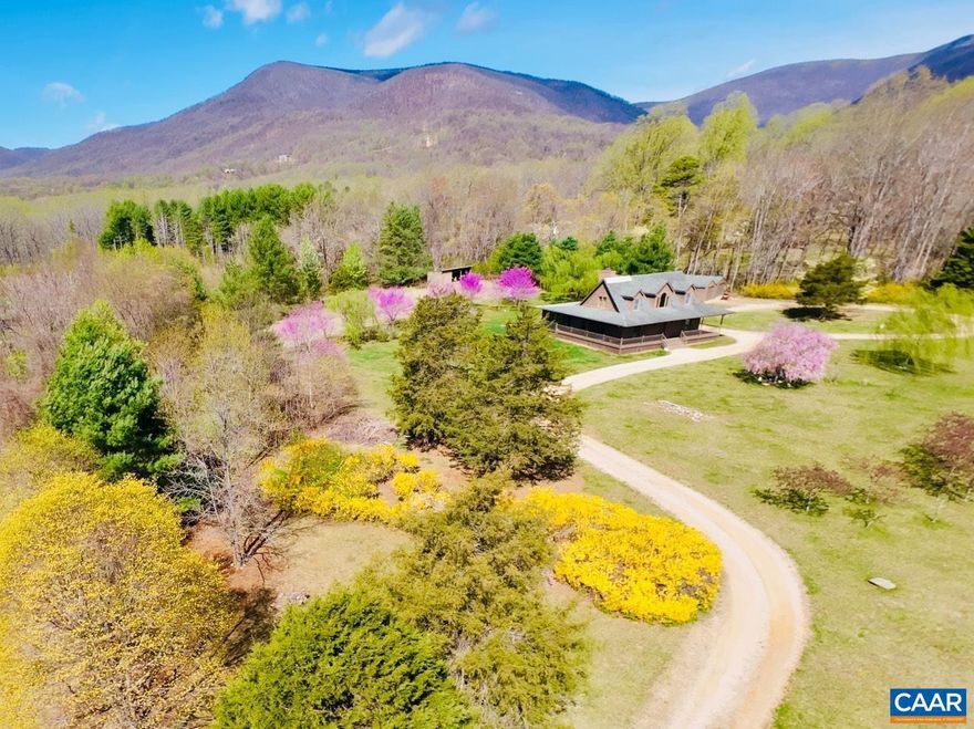 Mountain views in the heart of Nellysford! Wonderful full time residence or second home getaway with easy access to Nelson 151 activities such wine/brew trail, Rockfish Valley hiking trails, farmers market, Wintergreen Resort activities for golf, skiing, and more?  If you love the outdoors this is a must see.  There are amazing mountain views and over 800 sq ft of outdoor living space with covered wraparound porch, screened porch, and a private back deck. Enjoy the peace and quiet from your spacious screened porch with no neighbors in sight. House is situated for great privacy and provides wonderful open and level yard/acreage for pets, play, and/or gardening. Interior features vaulted ceiling, floor to ceiling stone fireplace (wood burning), hardwood floors, newer Trane HVAC (2022), encapsulated crawl, 2 detached garage buildings, and ability to live on one level. Reserve upstairs for guests and/or home office. Work or school from home with fiber optic internet. Only 30 minutes to Charlottesville,Painted Cabinets,Solid Surface Counter,Wood Cabinets,Fireplace in Great Room