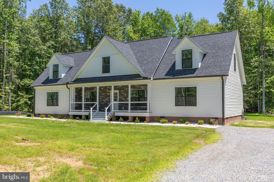 COMPLETE. This beautiful 4-bedroom, 3-bath Farm-style Cape Cod home is located on 4.02 Acres just minutes away from Kings Dominion and 6 miles from 95 in Caroline County! The open-concept living room features 9-foot ceilings, shiplap siding and tons of natural light. The kitchen is equipped with stainless steel appliances, quartz countertops, and a white mosaic backsplash. The main level also features luxury vinyl plank (LVP) flooring, custom tile showers, and barn doors that add to the farmhouse charm of the home. Additionally, the home has a fully finished upstairs with a tile shower and wet bar, a large living room, an additional bedroom, and a study. Home does come partially furnished- master bedroom, LR, DR, Kitchen and light decor! The exterior of the home features extensive landscaping, black gutters, and black stone accents, which complement the white siding and add to the home's curb appeal. The 12x16 Trex deck at the rear of the home, as well as the front porch area with Trex decking, provide perfect spots for outdoor gatherings and enjoying the serene surroundings. Septic is alternative. ALL FURNISHINGS CONVEY