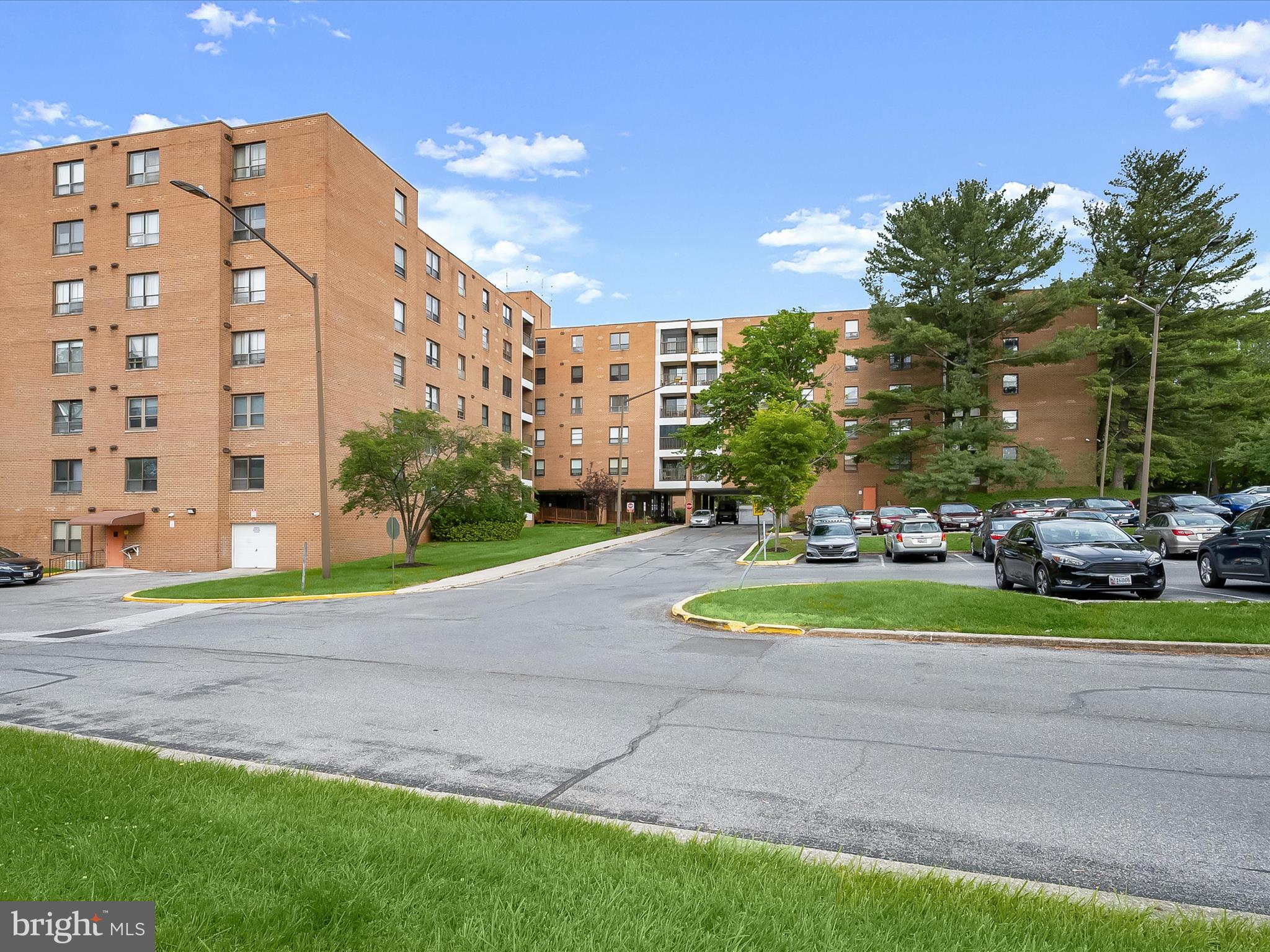 Welcome to this spacious two bedroom, two bathroom condo in The Elmont, located on the second floor with brand new carpet and fresh paint. The open concept living and dining areas can accommodate any size gathering and feature sliding glass doors to the balcony. The kitchen includes space for a breakfast table for casual meals, along with a pantry and stacked laundry. Down the hall, the large primary bedroom offers a walk-in closet and an en-suite bathroom with a walk-in shower and an additional linen closet. Finishing the unit are the second bedroom, a second bathroom with a tub/shower, and several storage closets, including another walk-in. The unassigned parking lot has ample parking, while the lobby features 24-hour security. Excellent location near Pikesville and Mt. Washington, just minutes from the Reisterstown Plaza Metro SubwayLink Station, I-695, I-83, and I-795.