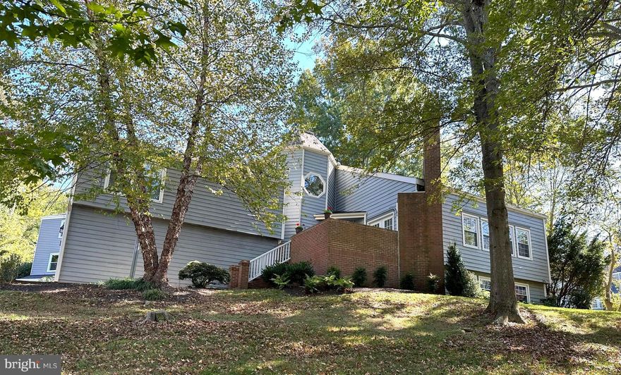 Welcome to this Captivating Contemporary in the popular, sought-out golf and tennis community of Hobbit's Glen.  This 4/5 bedroom with 4 ½ bath home is the perfect blend of modern style while exuding a feeling of warmth and comfort. Custom built by Arthur Cotton Moore, the design details will delight you throughout all 4 levels of this unique floorplan.  You’ll find soaring ceilings, walls of windows, multiple skylights, gorgeous hardwoods, 2 gas fireplaces, 2 laundry rooms and a 2 Story Sunroom addition with heated floors and a circular staircase to an upper-level balcony with French doors.  The Primary Suite, on it’s own level, provides the perfect and private retreat and is graced with a European inspired luxury bath that is simply beautiful with a separate soaking tub, double vanities, and custom tiled shower.  The third level is where the 3 additional bedrooms and 2 full baths are located and has an overlook to the sunroom. The light filled lower level is quite expansive with a spacious recreation room, a bedroom/bonus room, newly finished full bath, multiple storage areas and a wet bar with frig.  On the exterior there is a maintenance free side porch off the sunroom and a front deck area with a view of the golf course.  The new roof with transferrable warranty is an added bonus.   Walk to Hobbit’s Glen pool, tennis courts, golf course and the popular clubhouse restaurant. Located near the end of a cul-de-sac, this home has over 4,500 sq ft of beautifully finished space and is truly a Gem………… one that you would be proud to call home!!