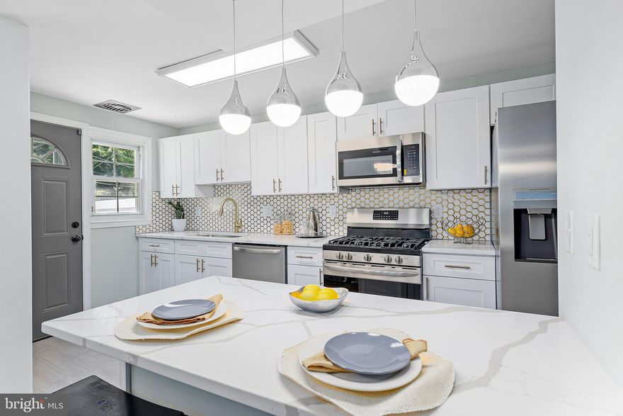 Your Gorgeous Edmondson Heights Home Awaits You!!!  Fully renovated kitchen with soft close cabinets, stainless steel high end appliances, Marble backsplash, Quartz Countertop, spacious island off the  kitchen. Bathrooms remodeled , new refinished hardwood flooring all throughout main and upper level.  Your new home is a short distance to downtown Baltimore and surrounding counties. A Must See!!!!