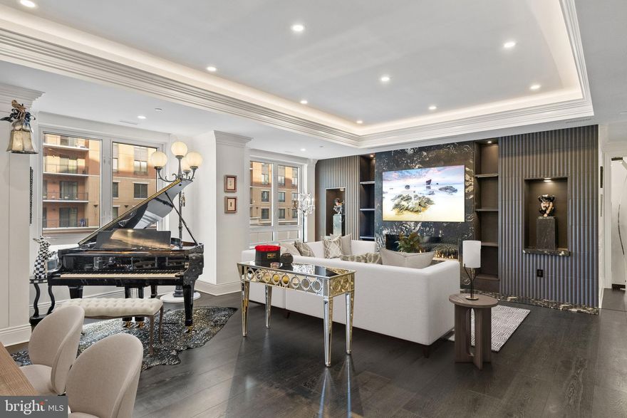 Experience luxury living at its finest in this extraordinary residence that combines two units into one expansive, stunning home in Annapolis Towne Centre offering over 3,400 square feet of impeccably finished living space. Completely gutted to the studs and reimagined, this one-of-a-kind home places you right in the center of it all—and only minutes from Downtown Annapolis—yet feels like a private retreat from the world.

Designed for both grand entertaining and everyday comfort, the custom gourmet kitchen anchors the home and flows seamlessly into inviting living spaces. Sound-proof, glass-tempered doors allow rooms to transition effortlessly from open and connected to intimate and private. Thoughtful details include hidden, built-in Sonos speakers, exquisite moldings, tray ceilings, modern lighting, and a stunning blend of wood and marble flooring throughout.

Wine enthusiasts will appreciate the climate-controlled wine room, while the primary suite is a true sanctuary, featuring a glamorous dressing room, multiple custom closets with secret storage, and a spa-like ensuite bath with hand-cut mosaic tile flooring and an oversized walk-in shower with glass door linen closet. 

Featuring a fully integrated Lutron smart home system, this residence offers effortless control of lighting, motorized shades, audio, temperature, and security access.  Additional highlights include three additional bedrooms, two additional full baths, four garage parking spaces and two storage units. 

Residents enjoy world-class amenities including concierge service, fitness center, yoga studio, library, meeting rooms, elegant lounge spaces, and a spectacular rooftop pool—delivering a lifestyle that is as effortless as it is refined. 

Towne Centre has become the new heart of Annapolis — a vibrant destination where you’ll find everything you need, from grocery shopping and a premier fitness center to exceptional dining and upscale retail.