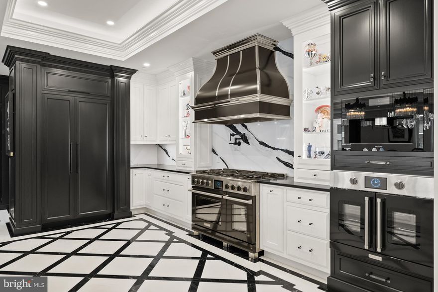 Experience luxury living at its finest in this extraordinary residence that combines two units into one expansive, stunning home in Annapolis Towne Centre offering over 3,400 square feet of impeccably finished living space. Completely gutted to the studs and reimagined, this one-of-a-kind home places you right in the center of it all—and only minutes from Downtown Annapolis—yet feels like a private retreat from the world.

Designed for both grand entertaining and everyday comfort, the custom gourmet kitchen anchors the home and flows seamlessly into inviting living spaces. Sound-proof, glass-tempered doors allow rooms to transition effortlessly from open and connected to intimate and private. Thoughtful details include hidden, built-in Sonos speakers, exquisite moldings, tray ceilings, modern lighting, and a stunning blend of wood and marble flooring throughout.

Wine enthusiasts will appreciate the climate-controlled wine room, while the primary suite is a true sanctuary, featuring a glamorous dressing room, multiple custom closets with secret storage, and a spa-like ensuite bath with hand-cut mosaic tile flooring and an oversized walk-in shower with glass door linen closet. 

Featuring a fully integrated Lutron smart home system, this residence offers effortless control of lighting, motorized shades, audio, temperature, and security access.  Additional highlights include three additional bedrooms, two additional full baths, four garage parking spaces and two storage units. 

Residents enjoy world-class amenities including concierge service, fitness center, yoga studio, library, meeting rooms, elegant lounge spaces, and a spectacular rooftop pool—delivering a lifestyle that is as effortless as it is refined. 

Towne Centre has become the new heart of Annapolis — a vibrant destination where you’ll find everything you need, from grocery shopping and a premier fitness center to exceptional dining and upscale retail.