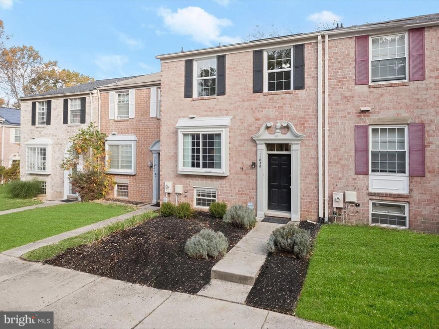 Welcome to 11838 New Country Lane, a solid brick townhome with 2400 sqft of living space nestled in the charming Clary’s Forest neighborhood of Columbia! The main level welcomes you with beautiful hardwood floors and an expansive, updated kitchen featuring granite countertops, stainless steel appliances, ample cabinetry, and a casual dining area. Perfect for entertaining, the living and dining rooms offer a warm ambiance, with the living room providing direct access to the deck. A convenient main-level powder room completes this floor. Upstairs, the primary bedroom features an en-suite full bath and hardwood floors, while two additional bedrooms each with hardwood floors and a full bath offer comfort and flexibility. The lower level presents a cozy family room anchored by a fireplace, with walkout access to the backyard, an additional bedroom, and a laundry room. This thoughtfully designed home blends style and functionality for a truly inviting living experience.