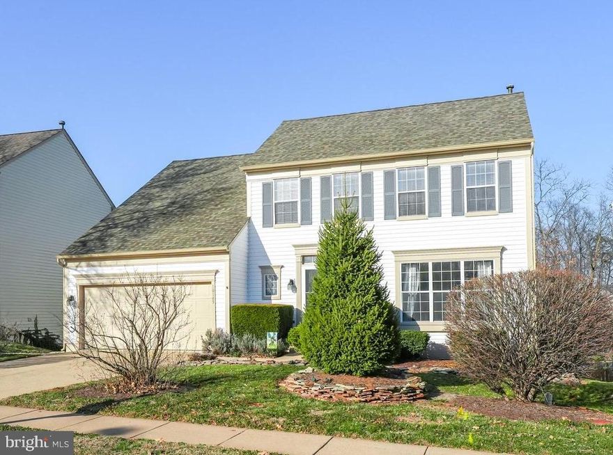 All wood or ceramic flooring (no carpet!) in this desirable three finished level colonial in the popular  amenity -rich Wellington community!  If into walks, enjoy the wooded trails at the end of your very own street!   Updated center island kitchen boasts newer stainless steel appliances, attractive tile backsplash and lovely new flooring. Regal moldings through living & dining rooms provide a classic, elegant fee and the bay window in the dining room yields so much natural light!  The upper level has an updated hall bath and a primary suite with a walk-in closet and renovated bath, along with 3 additional nice-size bedrooms!  Fully finished walkout lower level includes a spacious recreation room, true fifth bedroom and plenty of storage ! The decking, stone walkways, and gathering areas in this fenced yard  are perfect for having a glass of wine or a cup of tea!  Newer roof and a one year homeowner's warranty even come with it! Ideal location minutes to  Old Town Manassas, PW Parkway & Virginia Rail Express!