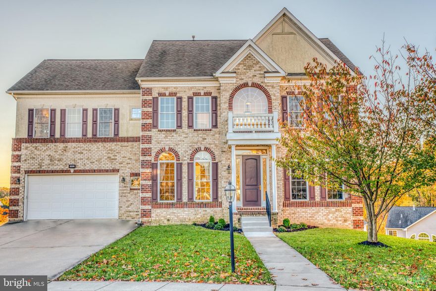 Perfection found in Perry Hall! This 4-bedroom, 3.5-bathroom brick-front Colonial will impress the pickiest buyer. From stately interior columns that accent a large formal dining room with beautiful moldings and windows, to the dramatic 20 foot ceilings in the living room, and first floor den/office, you ll be wowed at every turn. The gourmet kitchen boasts hardwood floors, cherry wood cabinets, granite counter tops, breakfast bar, a double sink, and stainless steel appliances, including the coveted double oven. Upstairs, spread out in a spacious suite fit for a king and queen with a deluxe master bath, and take advantage of three additional bedrooms.  The large unfinished basement holds more than your things, it holds the possibilities of whatever you can dream man cave, rec room, additional bedroom?  With parking for up to six cars in the quiet cul-de-sac location, there are great play areas including swimming at the Moores Meadows neighborhood pool. Walk to the neighborhood schools and enjoy the convenience of proximity to all of Perry Halls shopping and dining amenities. This home has fresh paint and new carpet throughout and is completely turnkey. It just needs you.