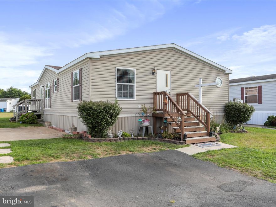 Welcome to this well-maintained double-wide located in Lakeside Village community! Offering 3 bedrooms and 2 full baths. Traditional layout offers a spacious living room with a gas fireplace. Adjacent dining room that flows into a large eat-in kitchen, complete with a breakfast bar, generous countertop space, ample cabinetry, and additional dining area. Primary bedroom offers a walk-in closet and en suite bath with a soaking tub, stall shower, double sinks - a true retreat. Separate laundry area with hookups. Enjoy all the benefits of park living - ground rent of $745/month includes trash, recycling, taxes, use of community center, exercise room and swimming pool. Buyer must be approved by park. Application fee is $25 for each adult on title & lease and $18.95 for anyone above 18 yrs old, and can be obtained by calling the park. Great location! Minutes to I-81 and I-70, shopping mall, dining and stores. Schedule your showing today!