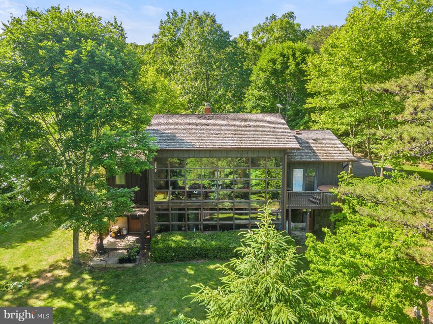 Offer DL 11am Monday 6/5

One-of-a-kind home, nestled very privately on the its charming 6+ acre lot with Shenandoah National Park views. With the convenience of a Starbucks just 5 minutes away, you’ll be surprised at the tranquility. The front elevation is two stories of windows, setting the stage for your homecoming experience. Contemporary, rugged, modern and “log-cabiny” feel is inside and out. Exceptional outdoor living is rivaled only by the two levels of quaint comfort you’ll find inside encompassing more than 3200 sq feet of finished space. The chef’s kitchen, wide-plank wood floors, lower level wet bar/kitchen, high speed internet, peach trees, smoke pit and raised bed gardens are just scratching the surface of what this home has to offer. No HOA.