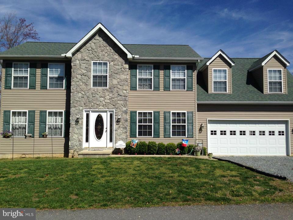 If you need ROOM, this is the house for you! FIVE spacious bedrooms, 3.5 baths, finished basement, family room with fireplace, HUGE level yard with privacy fence, 13X15 deck, playground and shed. Stainless steel appliances in kitchen. Easy maintenance hardwood and ceramic floors, formal dining and breakfast nook. 2 car garage on paved road near the beach. Over 3000 finished sqft!