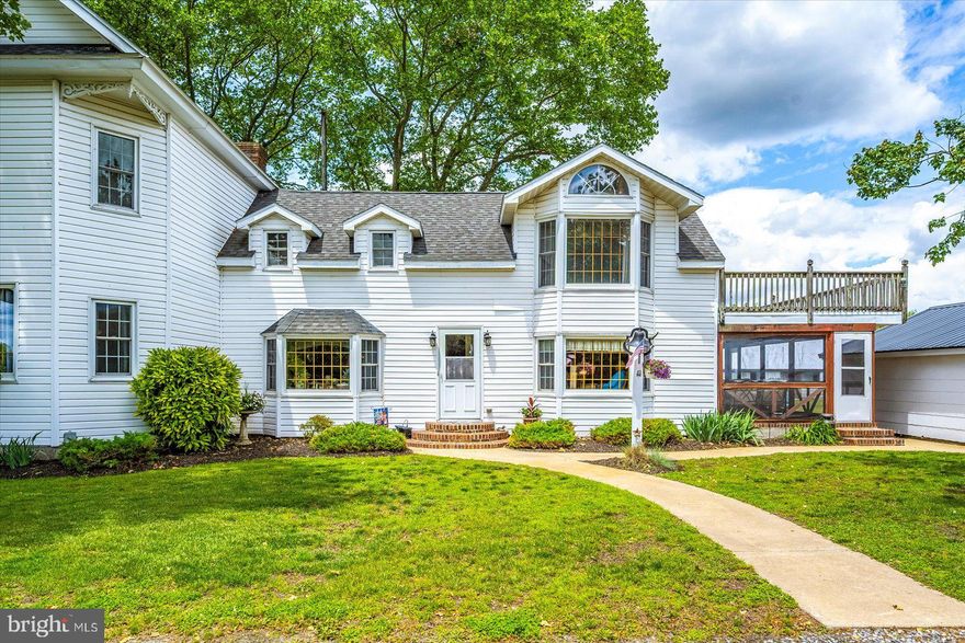 This charming farmhouse offers a rare opportunity to own a home that practically pays for itself - it generates enough income to cover most of the mortgage.  The property features a 2,500 +/- sq ft beautifully maintained farmhouse full of rustic charm and modern updates, including insulation, electrical, plumbing, drywall, with NEW siding, roofing, skylights, washer, and hot water heater. Enter the first floor into the newly renovated kitchen including the warm, cherry cabinetry, Cambria quartz countertops and subway tile backsplash, farmhouse/apron style sink, and stainless steel appliances. The spacious dining room has wide plank wooden floors and wooden beams on the ceiling. The front entryway opens into the large living room with high ceilings and natural light flooding the room, creating an inviting atmosphere. Additionally, a warm and cozy den feels like a hidden retreat from the world with floors covered in a thick carpet, a brick, gas fireplace, and wooden beams on the ceiling making the space feel sheltered and serene. A third entryway leads into a landing area featuring a full bath, laundry room, and storage. Enjoy outdoor living in the spacious screened-in porch with basketweave brick floor or enjoy the outdoors on the composite deck with hot tub, or the open concrete patio with brick edging and gardens. The second floor is where you will find three bedrooms and two additional full baths. The primary bedroom includes an ensuite bathroom with a luxurious soaking tube and walk-in shower, and private access to a large balcony. The other two bedrooms are generously sized with a lot of natural light. The farm is a working poultry farm with one well-maintained 400' x 40' house in production with a separate well and generator. There is a second poultry house that is cleaned out and can be re-purposed for storage, workshop, small animals to name just a few. Other improvements include a one-car detached garage, a barn with a full loft, and an 18' x 60' addition with concrete floors and work benches that has been used as a workshop. The addition is flanked with a lean-to for additional storage. Additional poultry information will be provided upon request.