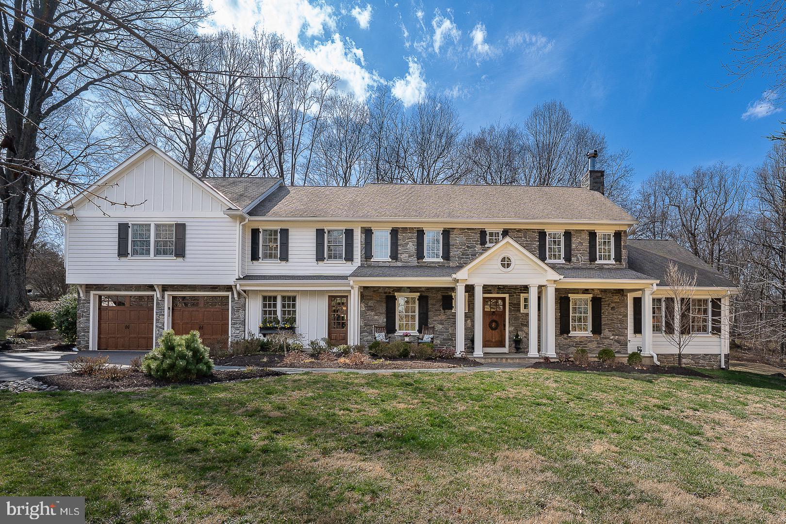 Welcome to 1309 Karen Lane! This completely renovated home by Gardner/Fox Associates boasts 5 Bedrooms and offers both timeless elegance and modern comfort in a stately Colonial. The exterior showcases a traditional stone façade complemented by mature landscaping providing great curb appeal. The walkway leads to a covered Entrance enhancing the home’s welcoming atmosphere. Inside you are greeted by a Foyer with designer finishes and crown molding. There is an open stairway to the right and a Powder Room to the left with a furniture-style vanity and a large closet. Past the Foyer you proceed to a spacious open floor plan. In the Living Room, the handsome fireplace is the focal point with a window seat on either side with storage below. Custom built-in bookshelves flank both sides of the entrance. There is a game table with an Atrium door that leads to the large Patio. Continue to the pocket doors which open into the fabulous and spacious Family Room with its striking Stone fireplace and lots of windows which offer an abundance of natural light overlooking the expansive yard. French doors open onto the Flagstone Patio with a stone wall on either side. The Patio overlooks the private backyard. Back in the Family Room there are pocket doors leading to a Sitting Room with wainscoting and built ins. There is access to the open stairway looking into the Foyer as well as leading to the 2nd floor. Back in the Living Room to the left is the Dining area with a great open space for eating and an Atrium door to the Patio. All of these rooms are enhanced with beautiful millwork, surround sound and handsome Hickory wide planked hardwood floors. The Dining area flows into the Gourmet Kitchen equipped with high end fixtures and appliances, a six burner gas stove and griddle, granite countertops, subway tile backsplash, a large Island with a sink, handsome cabinetry and another sink with cabinets above. There are two large corner pantries providing great storage. There is also plenty of workspace as well as a large picture window overlooking the expansive backyard. There is an abundance of recessed lighting throughout the Kitchen as well as a built in cabinet perfect for a bar area. Off the Kitchen is the Mud Room equipped with brackets for coats, a door to
the outside covered Porch as well as a door to the oversized two car Garage. The Mud Room has built in cubbies with a pocket door to the Powder room with a door to access the Foyer. The staircase leads to the second floor. The spacious Primary Bedroom has two deep closets, crown molding, recessed lights, a ceiling fan and speakers. The ensuite Bath is beautifully updated. It has two separate vanities, a steam shower with
a seamless shower door and radiant heated floors. Off the Hallway is a full Bath with a furniture-style vanity,
tub/shower with a door to Bedroom #2. There are three additional generous sized Bedrooms with large closets one of which is used as an Office with door to the floored Attic. Down the hallway are French doors which open into an Office. There is a large Laundry Room equipped with a sink & builts in for storage. There is another full Bath with a double sink vanity and a tub/shower. Back on the first floor, there is a stairway from the Family Room leading to the Lower Level providing a vast amount of additional living space. The Lower Level has a play area, Gym, Powder Room and French doors to the outside Hot Tub. The unfinished part provides Geo-thermal Heater, whole house water filtration & softening system & reverse osmosis water purification in Kitchen & ice maker, plus great storage. This home is conveniently located near major highways, making it easy access to Philadelphia, parks, the KOP Mall and the town of Wayne offering the local shops & restaurants, plus the award-winning Tredyffrin-Easttown Schools. This home offers unparalleled comfort and style with its prime location, impeccable condition and tasteful design. This is the one....Welcome Home!