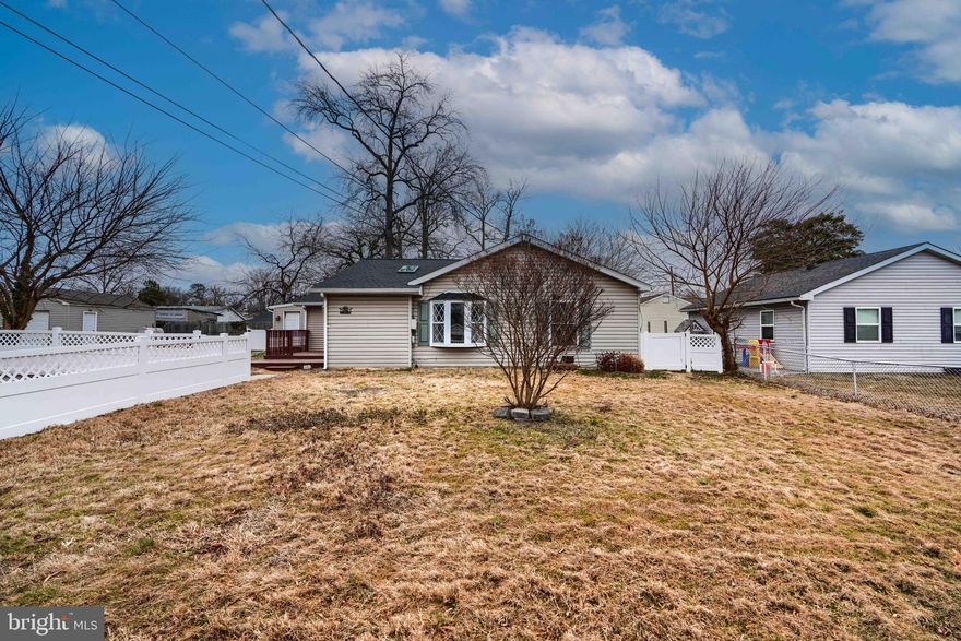 Back on the market. Appraised over list price.  Buyers got cold feet.  This three bedroom, one bath home is ideally situated in Wilson Point, walking distance to Beach Club.    Two blocks from water.  Updates include paint in all bedrooms and  architectural roof installed. (2024) Kitchen has stainless steel appliances, granite counters and pass through to living/dining area and two bay windows. .  Two additional bedrooms with ample closet space. Separate laundry room  with new washer/dryer and  closet.  Oversized primary bedroom (20x21), French  doors to sitting area (11x17) and door to outside area.  Hardwood floor throughout.    Front two tiered deck and stone patio.  Lot is  fenced in with newer white vinyl fencing.  Custom shed in rear for additional space. Four car parking pad for your convenience. See disclosures for accurate square footage per previous appraisal.  Immediate occupancy