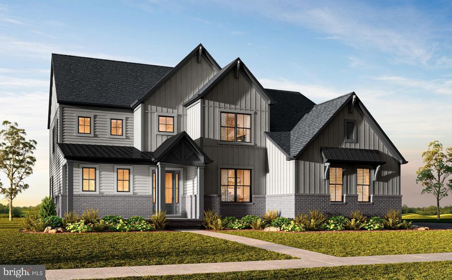 Beautifully appointed single family home in Oakton, VA available for quick move-in.
The open and airy main living level features an impressive kitchen with adjacent dining area, a main level bedroom, a spacious dining room, and a huge great room that has a gas fireplace and sliding glass doors that open to the covered outdoor living.  The Chef’s dream kitchen features Fog cabinets, Ethereal Haze quartz countertops, a large island with waterfall, KitchenAid stainless steel appliances, and an enormous walk-in pantry.  The Kitchen also has a prep zone featuring white cabinets that connects the kitchen and dining room.  Upstairs you’ll find a luxurious primary suite featuring a large bedroom with tray ceiling, two huge walk-in closets, and an upgraded primary bath with Nolita quartz countertops, and a separate soaking tub.  The second floor also has a secondary bedroom with private bath, two additional secondary bedrooms with Jack and Jill bath, a sizeable laundry room, and a cozy loft.  The lower level offers a large, finished rec room, an additional full bath, and flex room.  With just 5 homesites, Stuart Mill offers an exclusive opportunity to own a new luxury single family in Oakton, Virginia.