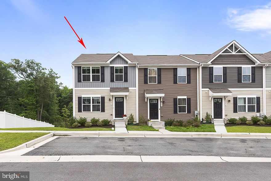 Welcome to 297 Tournament Circle in the coveted Chesapeake Club Community, a pristine 2022-built END UNIT townhouse that blends modern design with comfortable living. Nestled near the end of the community with serene wooded backdrops, this home features a sleek, open entertainment area adorned with soft lighting, creating a perfect ambiance for relaxation or social gatherings. The open floor plan unfolds, featuring a living room, dining area, and a stunning eat-in kitchen. The kitchen boasts black cabinets, a central island, and stainless appliances, all complemented by a large window offering tranquil views of the woods. The upper level offers three bedrooms and a convenient laundry area. The primary suite is a retreat with lush carpeting and expansive windows overlooking the woods and includes a primary bathroom & walk-in closet. The unfinished basement has an egress window and a walk-out door and is ready to be finished. Located with easy access to I-95, Rt. 40, and Rt. 272, 297 Tournament Circle offers privacy and convenience in a beautifully designed home ready to enhance your lifestyle. Don’t miss the chance to own this exceptional property in a vibrant community.