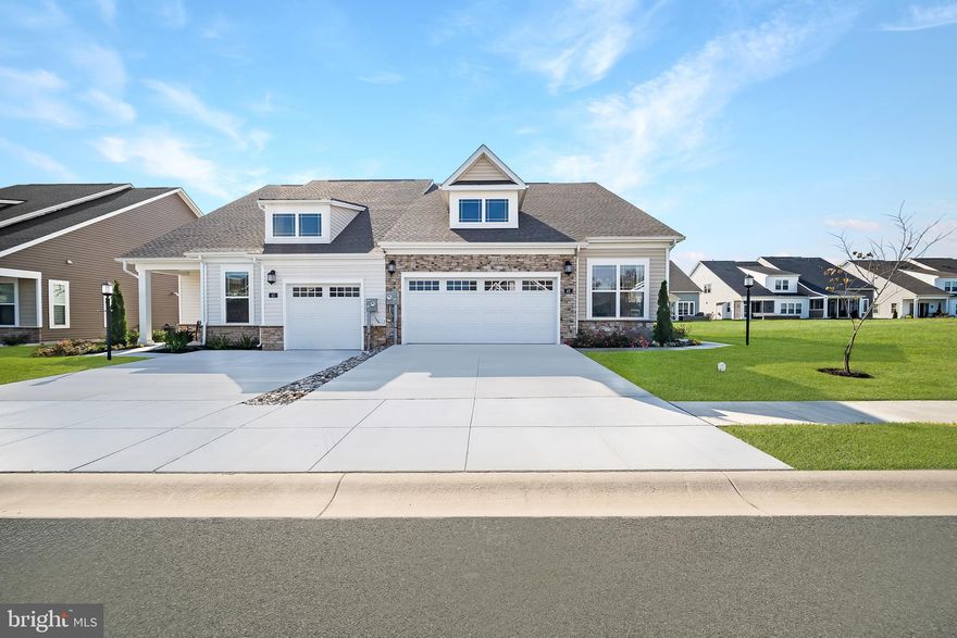 The Bancroft by Lennar homes is an elegant new construction villa located in the prestigious Amblebrook community. The exterior features a partial stone front that enhances the garage entrance, complemented by shaker style siding. This residence boasts an open-plan design that is ideal for everyday living. The kitchen is equipped with a spacious island adorned with iced white quartz countertops, a true double oven, a large walk-in pantry, and a gas cooktop with a sophisticated hood that matches the painted harbor cabinetry. The inclusion of soft-close drawers in the kitchen adds a touch of refinement.  Adjacent to the kitchen is the dining area, surrounded by windows that allow ample natural light to filter in. Next to the dining area is a sizable family room, perfect for entertaining. A few steps away is the owner's suite, which serves as a tranquil retreat with a tray ceiling and crown molding. The connected spa-like bathroom features quartz countertops, an expansive shower with seating and a frameless door, and a large closet. On the opposite side of the home, there is a secondary bedroom and a full bathroom, making it an ideal space for guests or a home office. Prices and features may vary and are subject to change. Photos are for illustrative purposes only. Agent must accompany their client on the first visit.