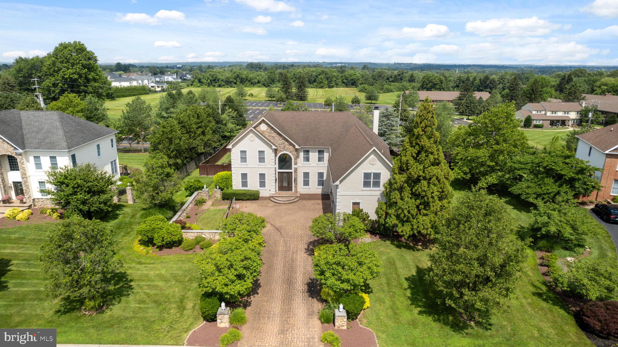 This one of a kind luxurious home located in sought-after Northampton Hunt & the prestigious Council Rock school district rests on over half an acre of professionally landscaped property. Enter into a 2 story Grand Foyer w/elegant curved staircase, porcelain tile floors and extensive moldings throughout the first floor. The formal Living Room features crown molding, plantation shutters, and tastefully done glass wall accent. The large formal Dining Room, perfect for family dinners, has custom crown moldings, wainscoting and custom bar area for entertaining convenience. Entering the kitchen, you will find a one of a kind custom kitchen designed. Kitchen features a very large island with quartz countertops, drawers & cabinets. The top of the line appliances include a built in Sub Zero refrigerator, stainless steel double wall ovens, 5 burner gas cook top with pot filler, 2 dishwashers, wine fridge and built in microwave. There is pendant lighting over the island, & an abundance of recessed lights. The large eating area features large sliding doors leading to the Blue Stone patio with in-ground pool overlooking the private outdoor oasis. The outdoor area also features custom kitchen perfect for outdoor entertaining. From the kitchen opens to the 2 story Great Room with floor to ceiling windows. This great room features custom coffered ceiling and floor to ceiling stone gas fireplace. This room also provides a second staircase for access to the second floor. On the same floor is a large office/study with french doors. There is a lovely powder room has wood accent wall and LED mirror with push button. Also, you'll find a spacious laundry room with cabinetry and closet for storage. Upstairs you will find a large Master Suite with has crown molding, a tray ceiling, a wonderful sitting room, 2 sided gas fireplace & multiple custom designed closets w many drawers, and shelves. The elegant master bath with heated flooring has an oversized glass shower with double shower heads, Jacuzzi Tub, double vanity with quartz tops & an enclosed toilet area. There are 2 more bedrooms that share a Jack & Jill bath with a large double sink vanity, lots of cabinetry & drawers. The 4th bedroom has an en-suite bath. Completing this home is an oversized three car garage, surround sound entertainment system and smart home. Other notes worth mentioning - pool was plastered last year and pump was replaced. Everything in this gorgeous home is in perfect move in condition. Make your appointment today!!