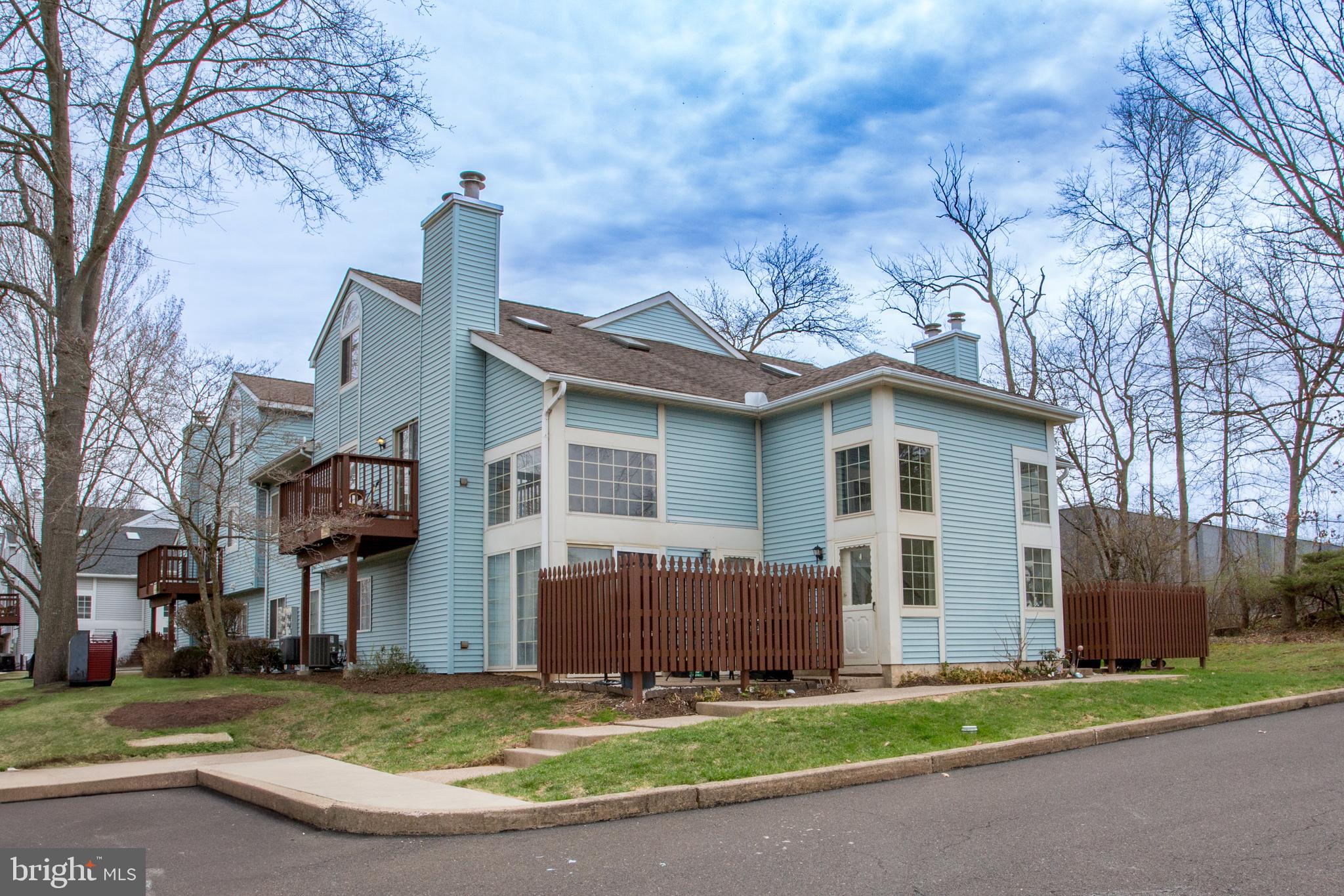 Welcome to this beautifully maintained two-bedroom condo in the highly desirable Lindenfield community! Step through the front door and head upstairs to a bright and airy living space that will instantly impress. The open-concept great room boasts a vaulted ceiling with skylights, a stunning stone wall with a cozy wood-burning fireplace and sliding doors leading to your private deck—perfect for unwinding and taking in the scenic views. Freshly updated with newer flooring and brand-new carpeting, this home is truly move-in ready. The spacious kitchen offers ample cabinetry, a dining area, and newer stainless steel appliances, making meal prep a delight. Down the hall, you'll find a comfortable bedroom and a recently remodeled full bath, along with a convenient main-level laundry area. Upstairs, a generously sized second bedroom features two double closets, another beautifully updated full bath, and access to attic storage. This home provides excellent living space with abundant storage (see floor plans in the attached documents). Major updates include a new hot water heater (2021) and an updated HVAC system (2022). Enjoy plenty of parking and a fantastic location just a short walk to North Branch Park, offering sports fields and a pavilion. You’ll also be minutes from Peace Valley Park, historic Doylestown’s shopping, dining, and entertainment, and the Chalfont Train Station—perfect for commuters. Don't miss this opportunity—schedule your showing today!