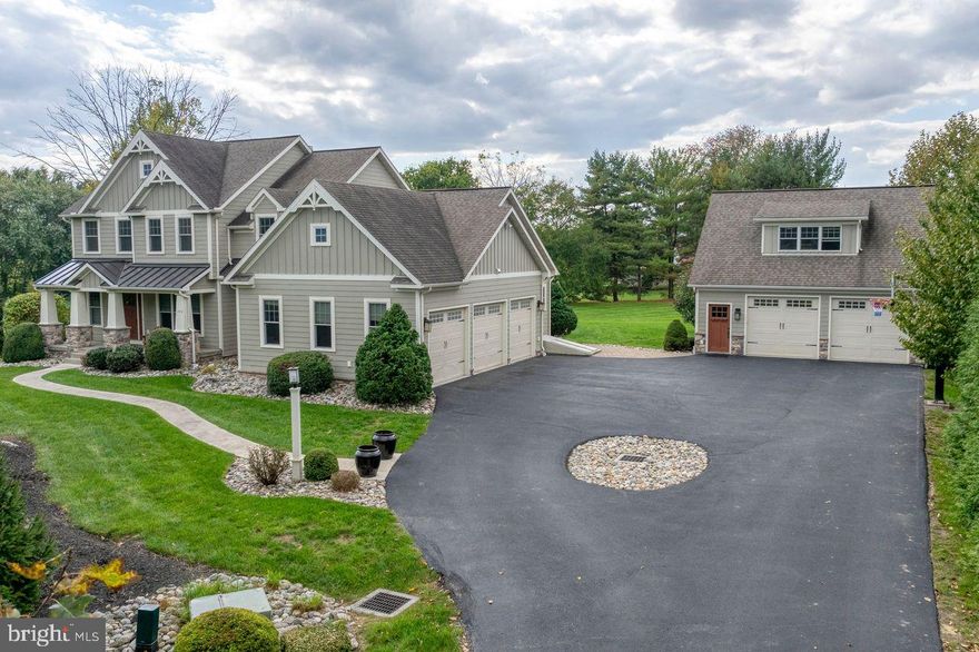 This exquisite custom home with 5 car garage is a rare gem.  Nestled on a pristine 1-acre flat lot within the Hempfield School District, the residence boasts a generous layout adorned with elegant hardwood flooring and comfortable living areas throughout. The inviting first-floor living area is accentuated by recessed lighting and an abundance of natural light, creating a warm and welcoming ambiance. The gourmet kitchen is a chef’s dream, featuring sophisticated cabinetry, state-of-the-art appliances, and a spacious walk-in pantry for ample storage.
On the second floor, you will find a princess suite with a full bath, as well as two additional bedrooms adjoined by a Jack and Jill bathroom. All bathrooms are equipped with sleek fixtures and modern finishes. As you continue down the hall, you will encounter the primary bedroom and bathroom, offering a serene retreat with comfort and privacy, as well as an abundance of storage and built-in cabinetry in the two walk-in closets.
Not to be outdone, the finished daylight basement is another standout feature, complete with a bedroom, full bathroom, kitchen with wet bar, and more storage. The exterior of this home is equally captivating, showcasing a charming porch, lush landscaping, and a tree-lined driveway leading to the home’s 3-car attached garage and the additional detached 2-car garage. This oversized space is a car enthusiast’s dream, ensuring ample parking and storage space. The finished living quarters above the detached garage feature an open living space, full bathroom, and full kitchen. The expansive lot provides room for a covered patio, generous outdoor living space, and a large flat yard perfect for various outdoor activities.
With the potential for 2 separate in-law his home offers an inviting and versatile living experience catering to a variety of lifestyle needs.