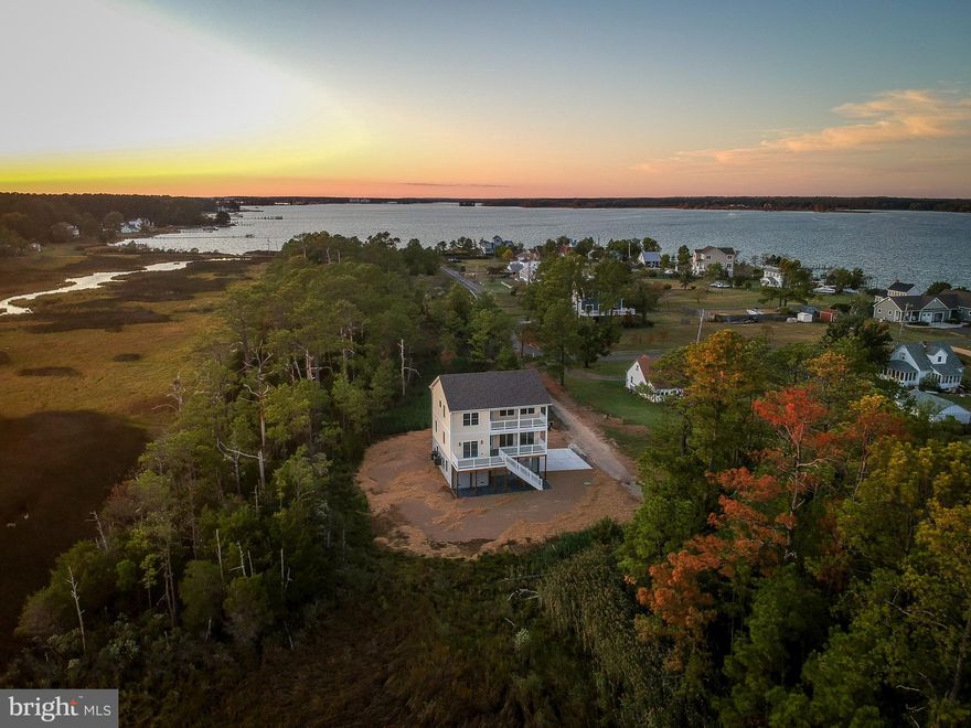 Brand new Coastal home with endless water views of St.George Creek & St Marys river. Bird lovers paradise.  Multiple outside spaces featuring Two 22 x 8 covered porches, one off of master bedroom, & 18 x 8 deck off of mid level bedroom.   Open floor plan with tons of natural light.  3rd level has great views from  master suite and 3rd bedroom.  Many upgraded features thru out  from this custom builder including granite counters, upgraded cabinets, wood floors, stainless appliances.  Over-sized carport and concrete parking pad. Large storage area (32 x 14) or make it a work shop.   Beautiful Interior colors and finishing touches.  Ready for occupancy.
