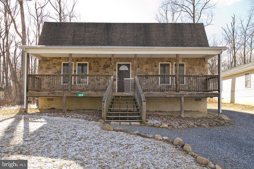 2 Bed/2 Bath home with a covered front porch. Stone front with wood laminate flooring throughout the main level.  The kitchen features track lighting, a cooktop, a wall oven, a breakfast bar, and a newer dishwasher. The upper-level primary suite includes a walk-in closet and a jetted tub. The upstairs office could serve as a third bedroom.  New HVAC on the main level.  Outside garden area. Vivint alarm system is inactive. *Home warranty available with acceptable offer.