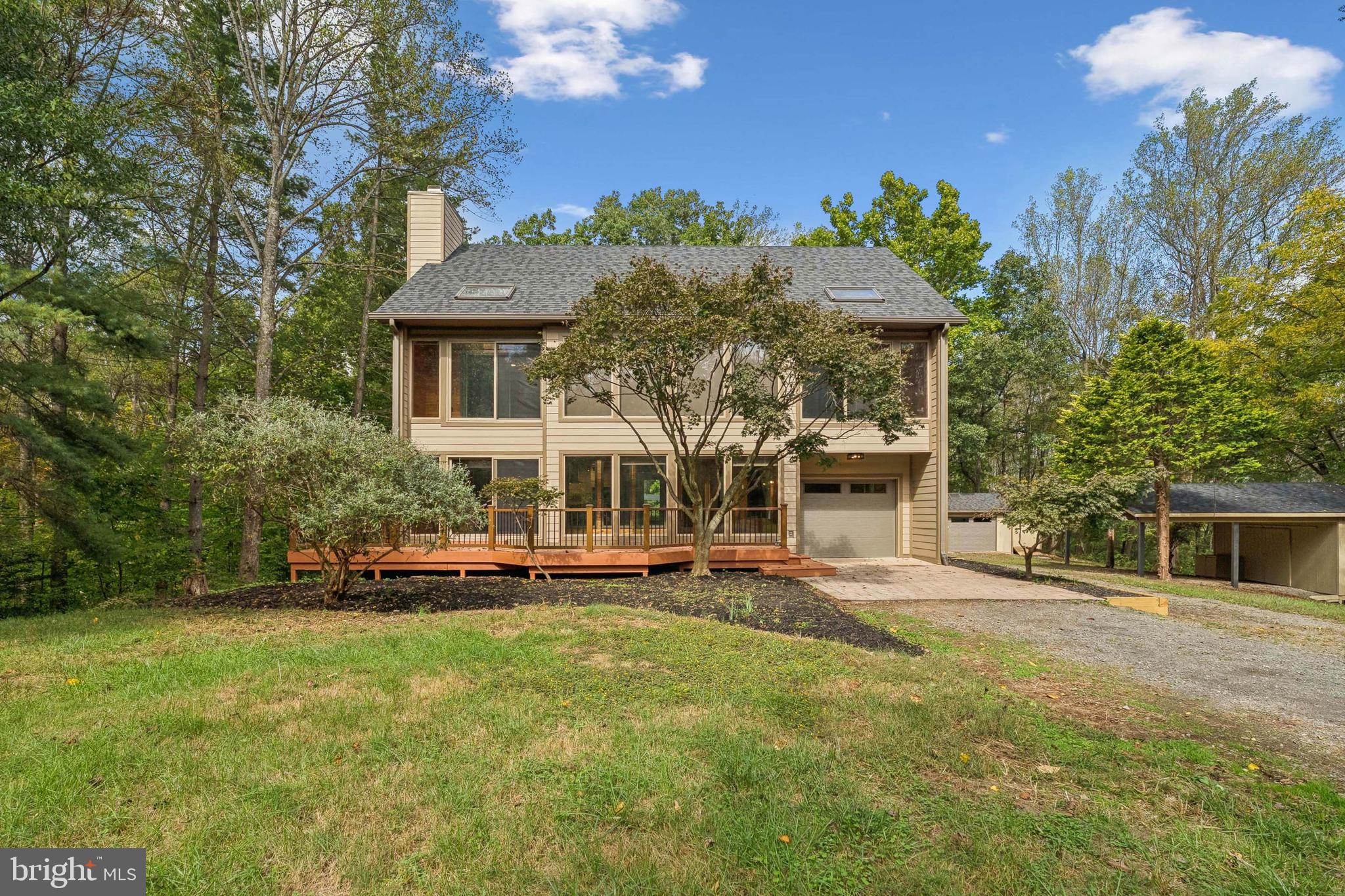 Experience the perfect blend of sustainability, luxury, and family-friendly living in this rare Solar Envelope home on over 10 acres in Leesburg. Designed to harness natural sunlight and ventilation, this innovative home maintains year-round comfort while lowering energy costs, offering bright and airy living spaces throughout. Fully renovated, it features a brand-new roof, two new HVAC systems, new hot water heater, updated garage siding and equipment, and a new pond pump.
The open main level showcases a new chef’s kitchen with quartz countertops, oversized island, backsplash, custom cabinetry, and high-end stainless steel appliances, flowing seamlessly into spacious living areas with LVP flooring, fresh paint, and modern lighting. Upstairs, you’ll find 4 generous bedrooms and 2 fully remodeled bathrooms with porcelain tile, vanities, and upgraded showers. The finished lower level provides flexible space for a family room, media area, home office, laundry, and abundant storage.
Step outside to enjoy a large deck, peaceful pond, detached 2-car garage that can double as a workshop, multiple storage sheds, a playground, and a scenic walking trail across the backyard. Perfectly located near Creighton Farms, major highways, and shopping centers, this home offers a rare opportunity to embrace eco-conscious living without compromising on luxury, convenience, or space for family and recreation.