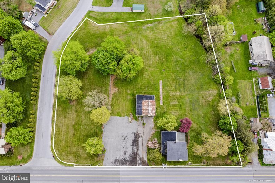 AUCTION DATE - MONDAY, JUNE 22, 2026, AT 4PM. LISTED PRICE IS AN OPENING BID ONLY AND IS NOT INDICATIVE OF THE FINAL SALE PRICE. REAL ESTATE: 2.4 ACRES commercial property Zoned Neighborhood Commercial w/2 sty. frame dwl. w/2176 SF finished area, kitchen, dining rm., living rm. w/stone fireplace, family rm., den, 4 bdrms., 1½ baths, full bsmt. w/outside entrance, oil HW heat. Outbldg.: Detached 1½ sty. gar./barn 38x34 w/2 large gar. bays & elec. all on level 2.4 ACRE lot w/326' road frontage along Rt. 625, (2) on-site well & (2) on-site sewer EDUs. Zoned Neighborhood Commercial w/potential uses included apt. dwl., retail, repair services, etc. NOTE: Tremendous opportunity to buy prime location. Four separate tracts totaling 2.4 ACRES selling all as one. Convenient location, minutes to Fivepointville, East Earl & Terre Hill. Terms 10% down, balance 60 days or before. Inspection at anytime.