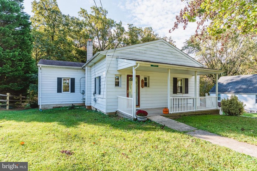 BRING YOUR ROCKING CHAIRS! THIS ADORABLE RANCHER SITS ON A THIRD OF AN ACRE WITH A LOVELY COVERED FRONT PORCH. UPDATES GALORE! FRESHLY PAINTED THROUGHOUT. 2 BEDROOMS ON MAIN LEVEL. NEW CARPET IN BOTH BEDROOMS. 1 FULL BATHROOM ON MAIN AND ANOTHER FULL BATHROOM IN BASEMENT. HARDWOOD IN LIVING AND DINING AREAS. UPDATED KITCHEN WITH WHITE CABINETS, STAINLESS APPLIANCES, TILE FLOOR AND BEAUTIFUL COUNTERTOPS. KITCHEN HAS TABLE AREA FOR EXTRA SITTING. PRIVATE ENTRANCE TO UPDATED BASEMENT. BASEMENT BOASTS GORGEOUS LVP FLOORING AND A FULL WALK IN CLOSET. PERFECTLY PRIVATE BACK YARD THAT BACKS TO A WOODED AREA. REAR YARD INCLUDES A FIRE PIT FOR LOTS OF ENTERTAINING. 1 CAR ATTACHED GARAGE IN REAR OF HOME. GREAT LOCATION!