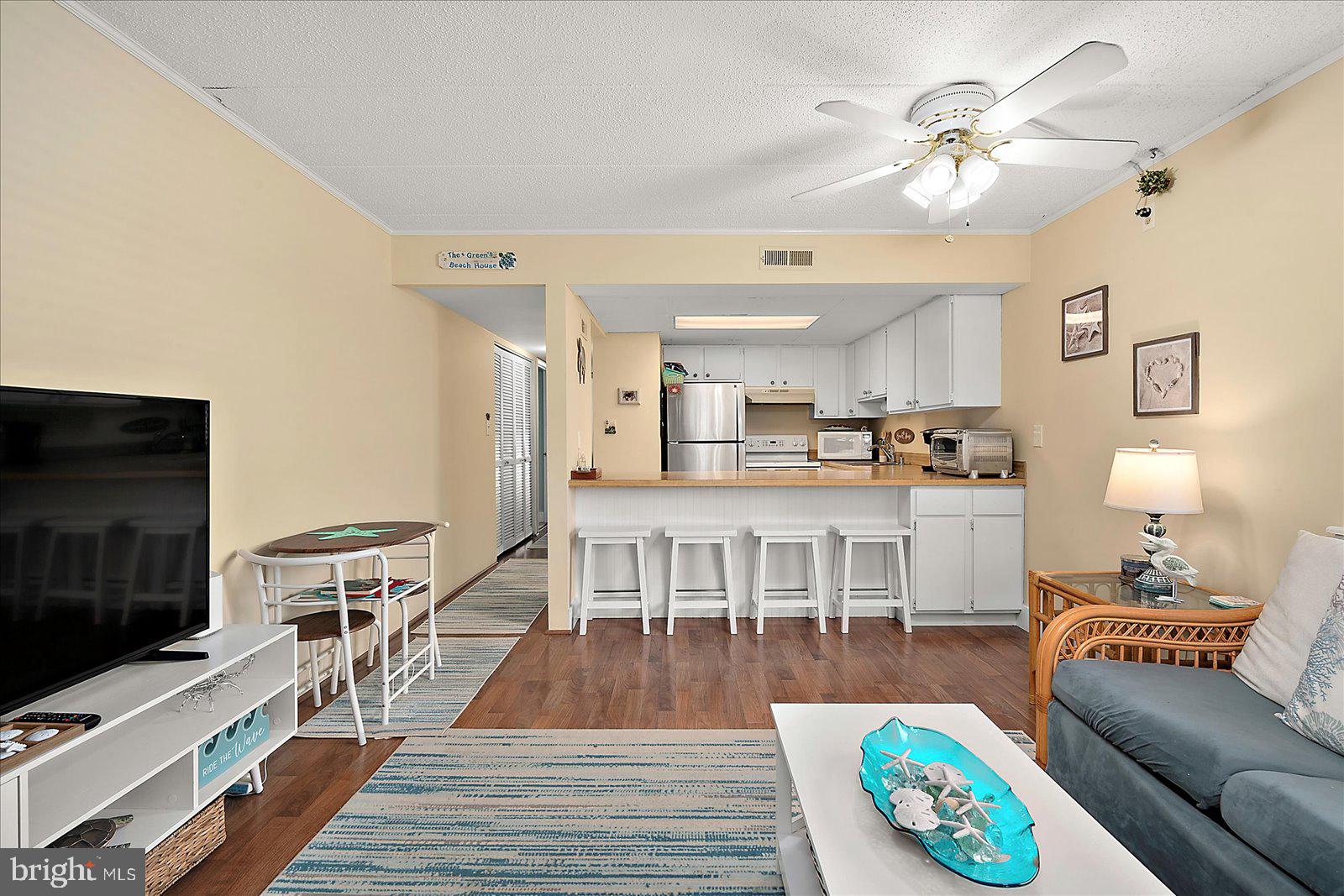 Ocean block 2BR/2BA Condo with Ocean & Bay Views – Midtown Gem! Discover coastal living at its best in this beautifully decorated 2-bedroom, 2-bathroom ocean block condo offering stunning views of both the ocean and the bay. With low condo fees and a relaxed coastal flare, this unit features tasteful updates and a spacious layout perfect for a beach getaway or year-round living. Enjoy the oversized private deck, ideal for morning coffee or evening sunsets. Located in Midtown Ocean City, you’re just steps from popular restaurants, entertainment, shopping, and grocery stores – everything you need is within reach. Recent building improvements include: Roof replacement (7 years ago), Parking lot resurfacing (1 year ago), Full exterior painting (2 years ago). Whether you're searching for a second home or a smart beach investment, this condo offers comfort, location, and value. Don’t miss your chance to own a piece of the beach!