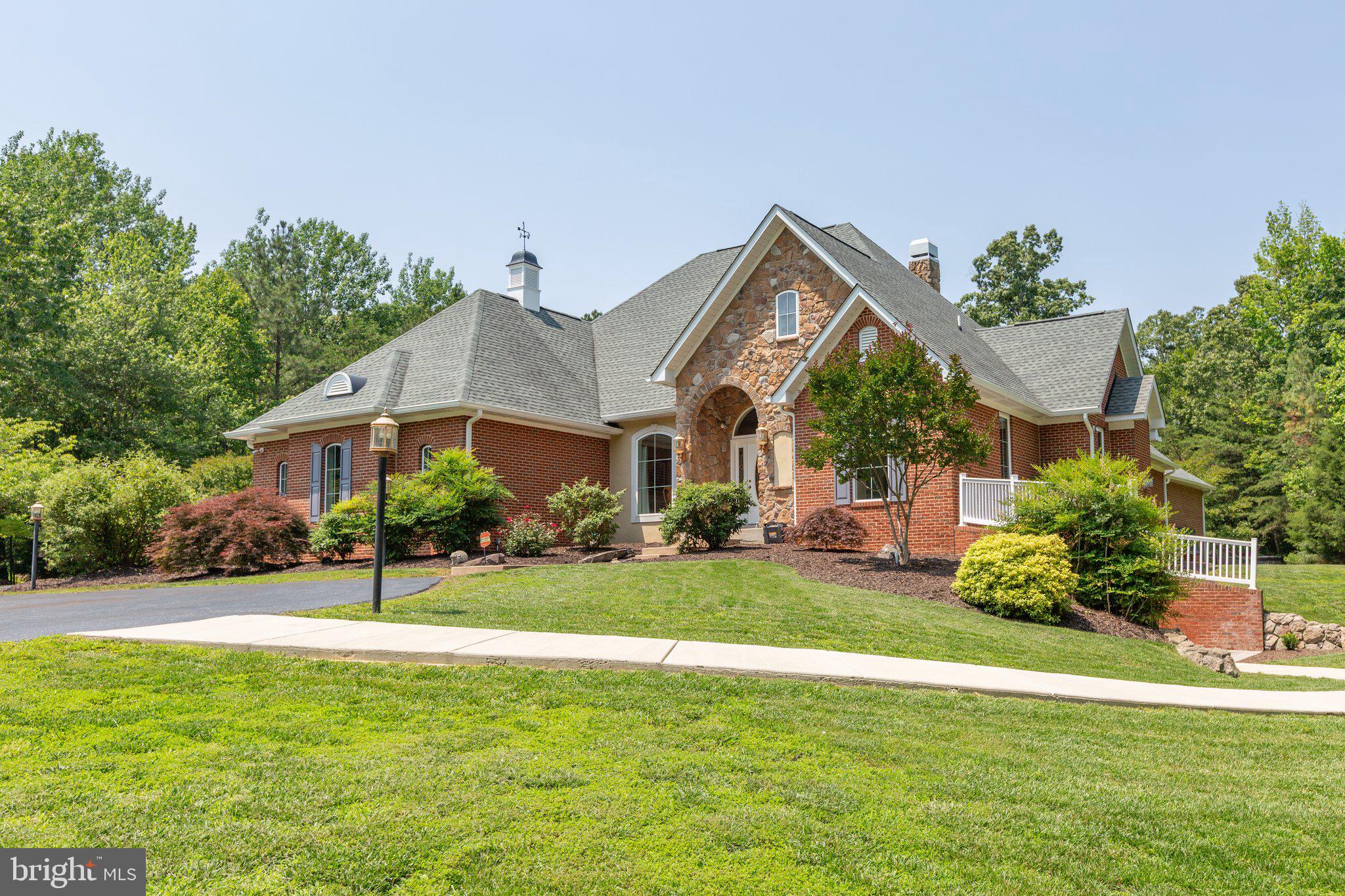 Luxury living with the privacy of approximately 227 acres!! Close proximity to the Potomac River! No HOA! High Speed Internet! Extended outdoor entertaining space with hot tub, pool with pool house, firepit and screened in Gazebo! Multi Generational Living!
This beautiful home offers one story living with the bonus of entertainment options outside & the lower level. Outside living offers saltwater heated pool with slide & hot tub waterfall. Pool house with 1/2 bath & plenty of space to relax. Follow the sidewalk to the fire pit area and screened in gazebo. Ready to go inside, let’s start in the basement. The basement offers theater room complete with surround sound seating with a 2nd kitchen ready for movie snacks. But that's not all, there is a room set up for crafting & another space set up for a den, both could very easily be NTC bedrooms, with a full bath in the basement. Main level offers open floor plan with Kitchen, dining & living room open to each other with cathedral ceilings making the space feel grand. Two of the bedrooms, one on each side of the home, offer Murphy beds and built in features, no additional furniture is needed. A Jack & Jill full bath with one of the bedrooms offering entry to its own private garage. The Primary & other bedroom are on the other side of the home. The primary bedroom offers lots of space to get comfortable including the primary bathroom. The closet in the primary area is one that offers lots of space, so much space it could be its own room. Finally going back outside there is another out building that has electricity, concrete floor and tons of space for storage or workshop. All of this situated on approx 227 acres and gives you all the space to spread out. ATV trails and great hunting land throughout the property. Two additional perc sites included with property.
