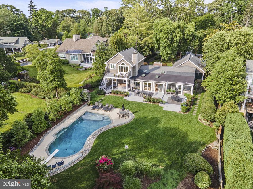 Don't Miss this Olde Severna Park gem!  Updates galore in this craftsman style 4 bedroom 3 full and 1 half bath home with huge views of the Severn River.  Enjoy summer days lounging by your rear oasis- 1.5+ acres. Gorgeous salt water pool, inviting deck & patio and so much privacy in your fully fenced rear yard. Bright and sun filled open concept home perfect for entertaining. Chef inspired gourmet kitchen with large center island, oversized gas range, farm sink, granite counters and so much more. Viking stove, subzero refrigerator, stainless range hood.  Relaxing primary suite on upper level with vaulted ceilings offering amazing views straight to the Severn River from your sitting area with walk out to your deck.  Private primary bathroom with steam shower & huge walk in closet.  Dual zoned HVAC. Updated lighting throughout, fresh neutral paint, gleaming hardwood floors.  Just a short distance to water access within Olde Severna Park.  Hurry, this one won't last!