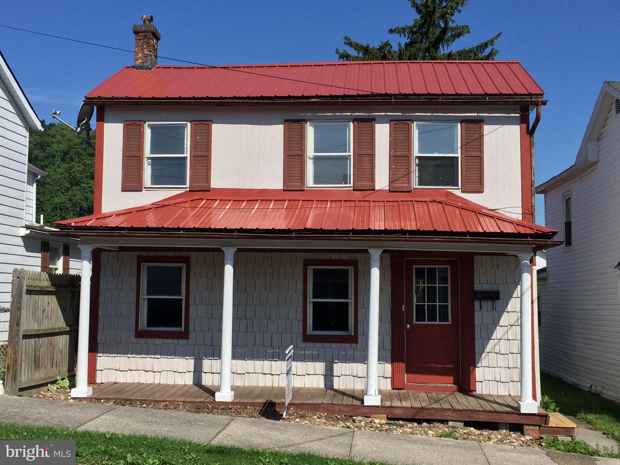 Spacious 3 bedroom 2 bath home in the heart of Keyser. Front porch is perfect for a swing and rocking chairs. Garage with workshop in back of home. Side deck off of kitchen and laundry hook ups are in kitchen nook. Priced to sell. Schedule your appointment to see today