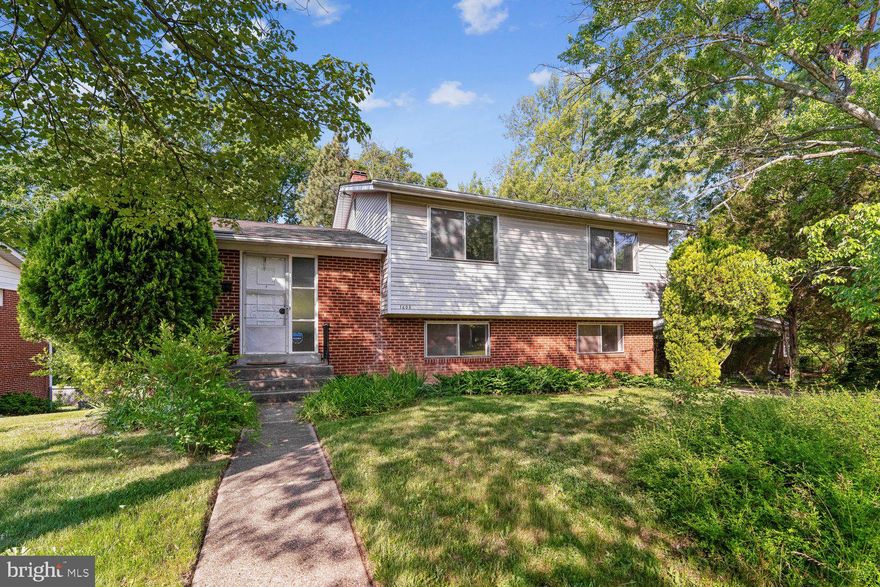 This 4-bedroom, 2.5-bath split level home offers incredible potential for buyers looking to add their own style and updates while living in a highly convenient location. Major recent improvements provide peace of mind, including a NEW ROOF (2024) and a NEW HVAC (2024)!  Highlights include hardwood flooring under carpeting just waiting to be revealed.  Filled with character and solid bones, this property is ready for your modern touches while offering plenty of space to grow. This is a rare chance to invest in a prime location and make a home truly your own. Set slightly above the neighboring homes, the property enjoys added privacy and peaceful tree views with a backyard setting that feels serene and tucked away. Inside, the large picture window in the living room fills the space with abundant natural light, creating a bright and welcoming atmosphere.  Home features a long concrete driveway providing off street parking for 3 cars and adjoining a convenient side entrance in the home.  Ideally located within walking distance to both the Indian Creek Park entrance and the Lake Artemesia Natural Area with its scenic walking and biking trails, lake views, nearby Metro and bus service, and local elementary and middle schools. Just minutes from the University of Maryland, shopping, dining, and major commuter routes including I-495 and Route 1, this home combines exceptional accessibility with the comfort of a quiet residential setting.
