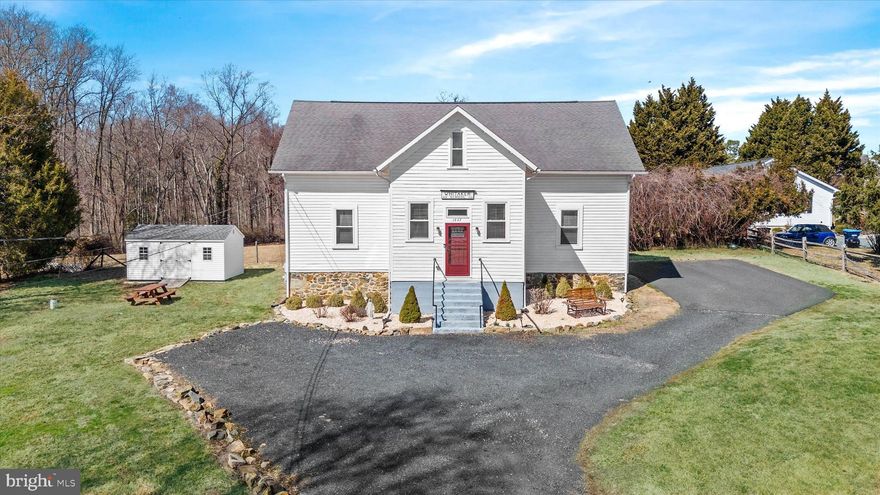 Remarkable historic home! Formerly the Whitaker School (1845-1931), this home is truly one of a kind and  features gorgeous architecture and an abundance of space! Upon arrival, you'll notice the beautiful stone foundation and elegant entryway. The foyer is pristine, bright and showcases what is believed to be an original chalk board from the Whitaker School. Choose from either door that leads to a stunning open-concept first-floor living area complete with beautiful hardwood flooring, huge kitchen and ample room for dining, gathering, and even a spot for an office or play-space! The first floor can be used as-is or perhaps sectioned off further if desired. A full bathroom with tub/shower combo and the laundry room just off the side-door round out the main level. The second floor is metered separately from the first floor and features it's own kitchen, living room, and even has space for a dining room table! Additionally, the upstairs has two bedrooms, a bonus room, and a massive full bathroom. The basement and crawlspace make for great storage locations. Outside, the .67-acre property includes a fenced yard with a swinging gate across the massive driveway - you won't have to worry about shuffling cars with as many vehicles as it can accommodate! Upgrades include basement and crawlspace waterproofing/encapsulation (2021), new well pump (2022), new windows downstairs (2022), first floor mini-split (2023), and new 10x16 shed (2023)!